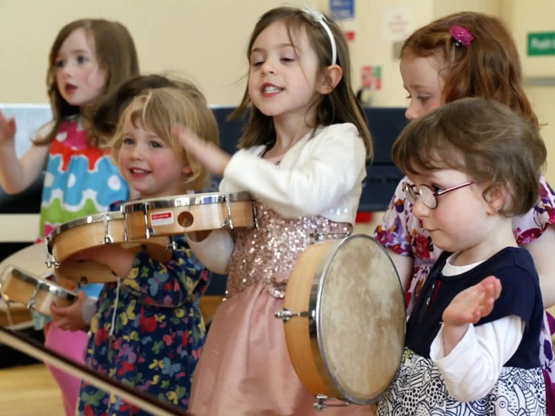 a group of girls playing drums