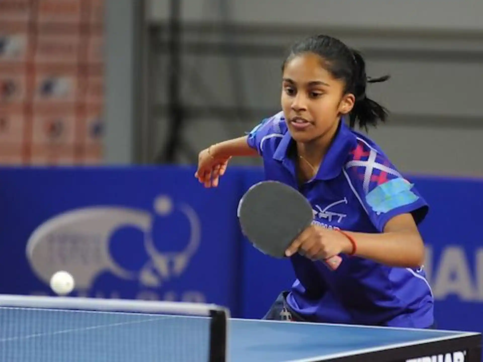 a person playing table tennis