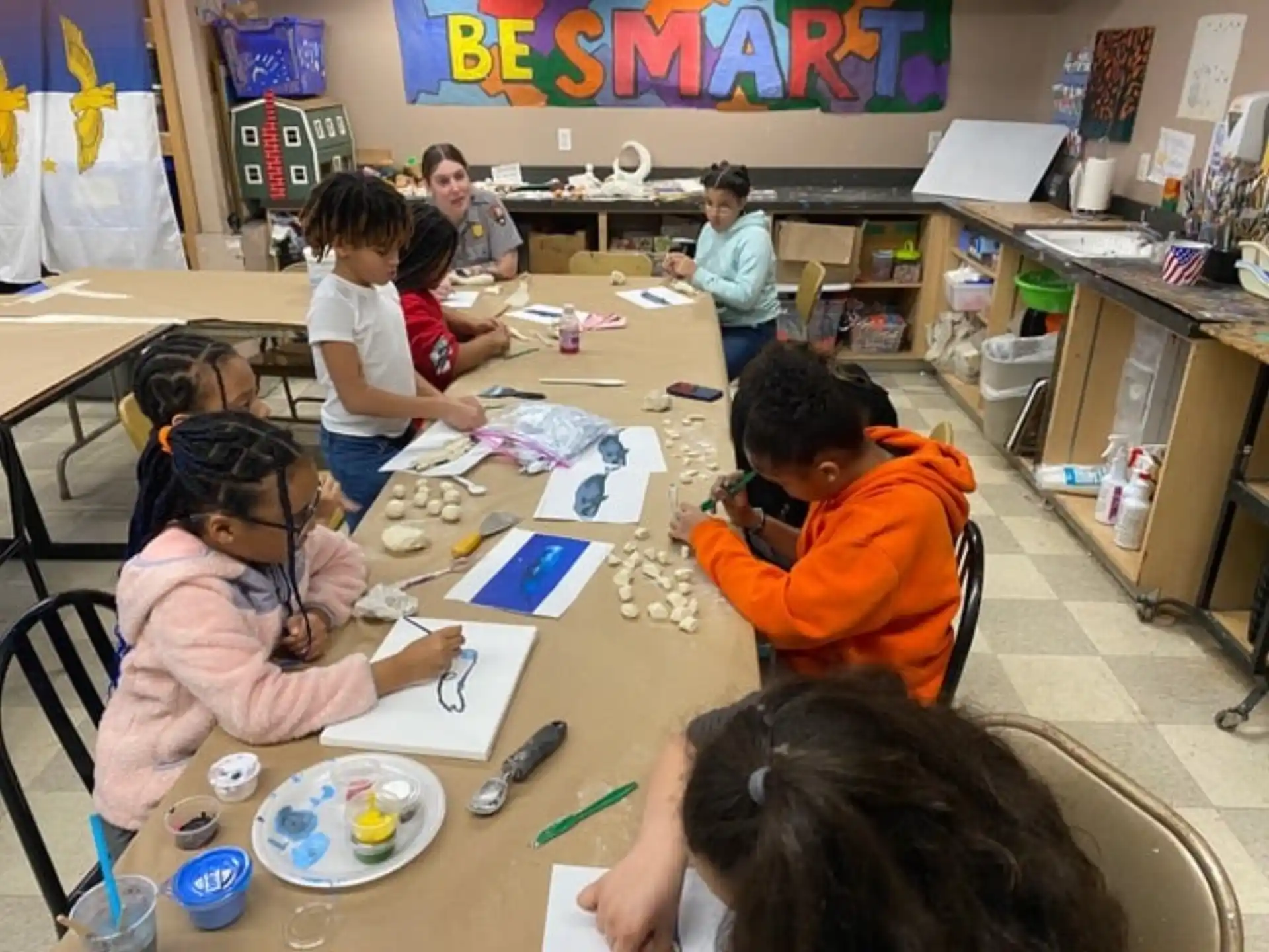 a group of children sitting at a table