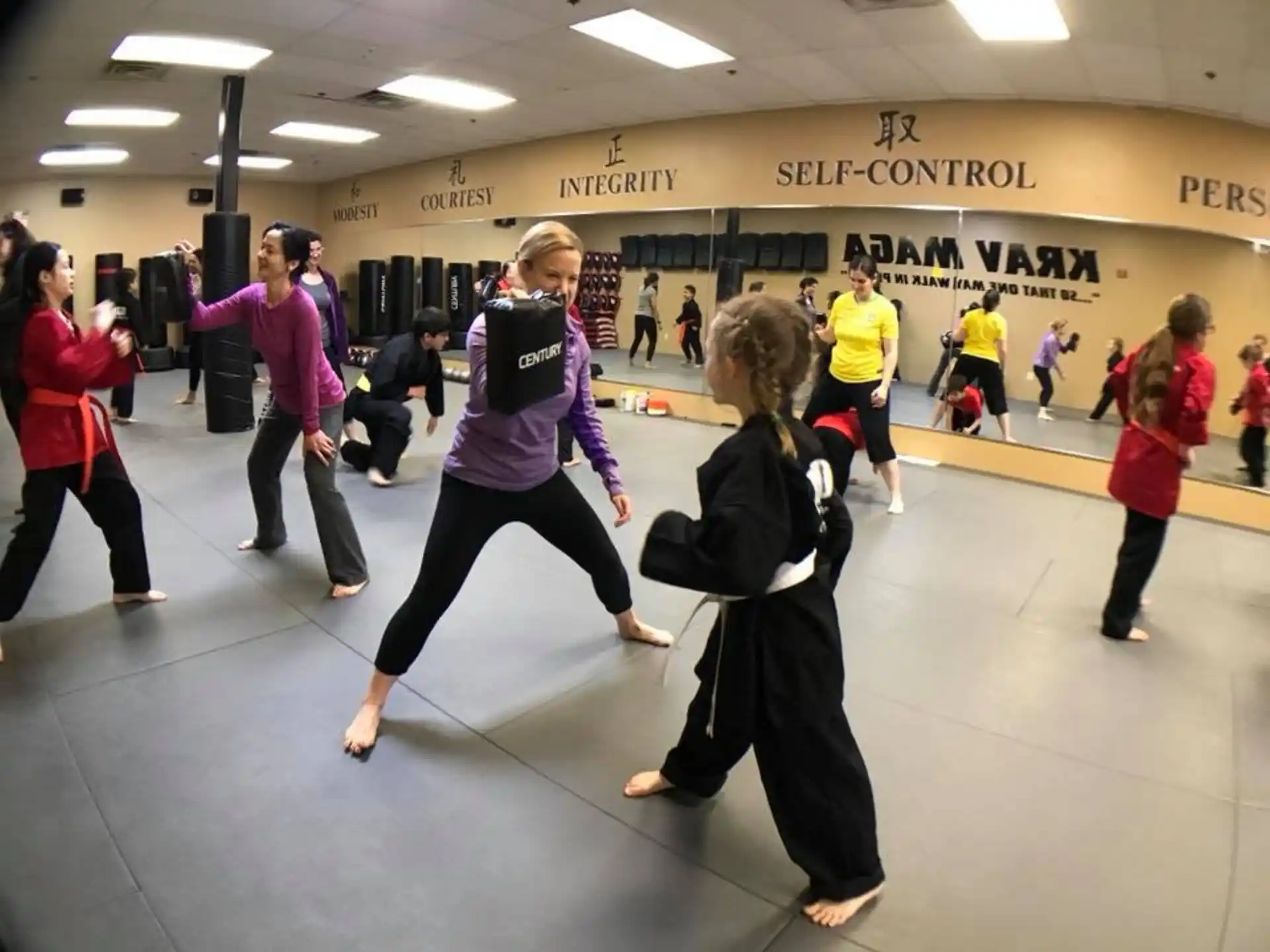 a group of people exercising in a gym