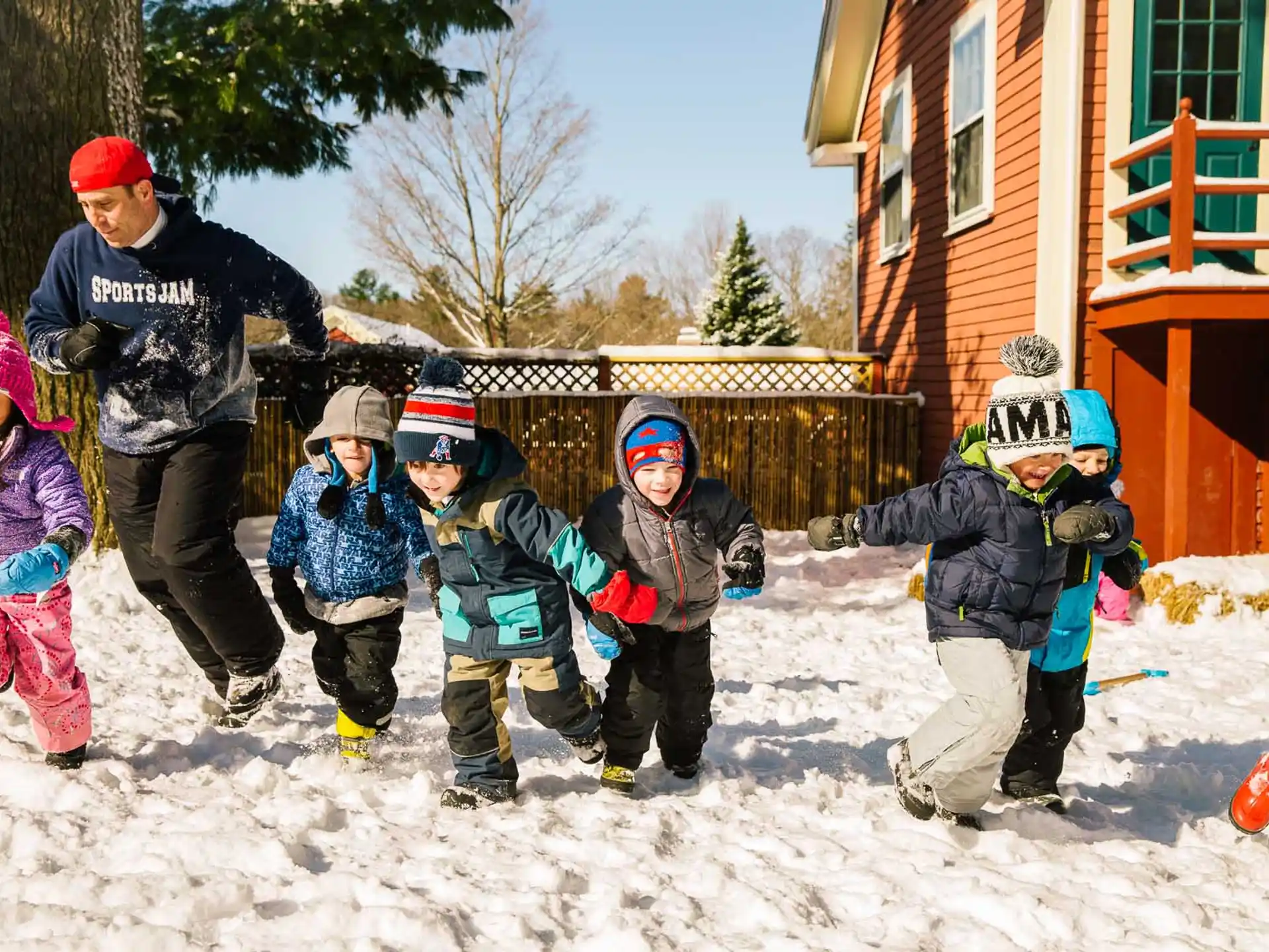 a group of kids in the snow
