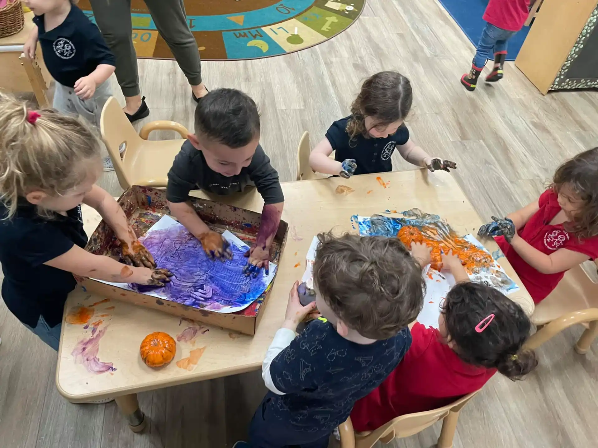 a group of children painting