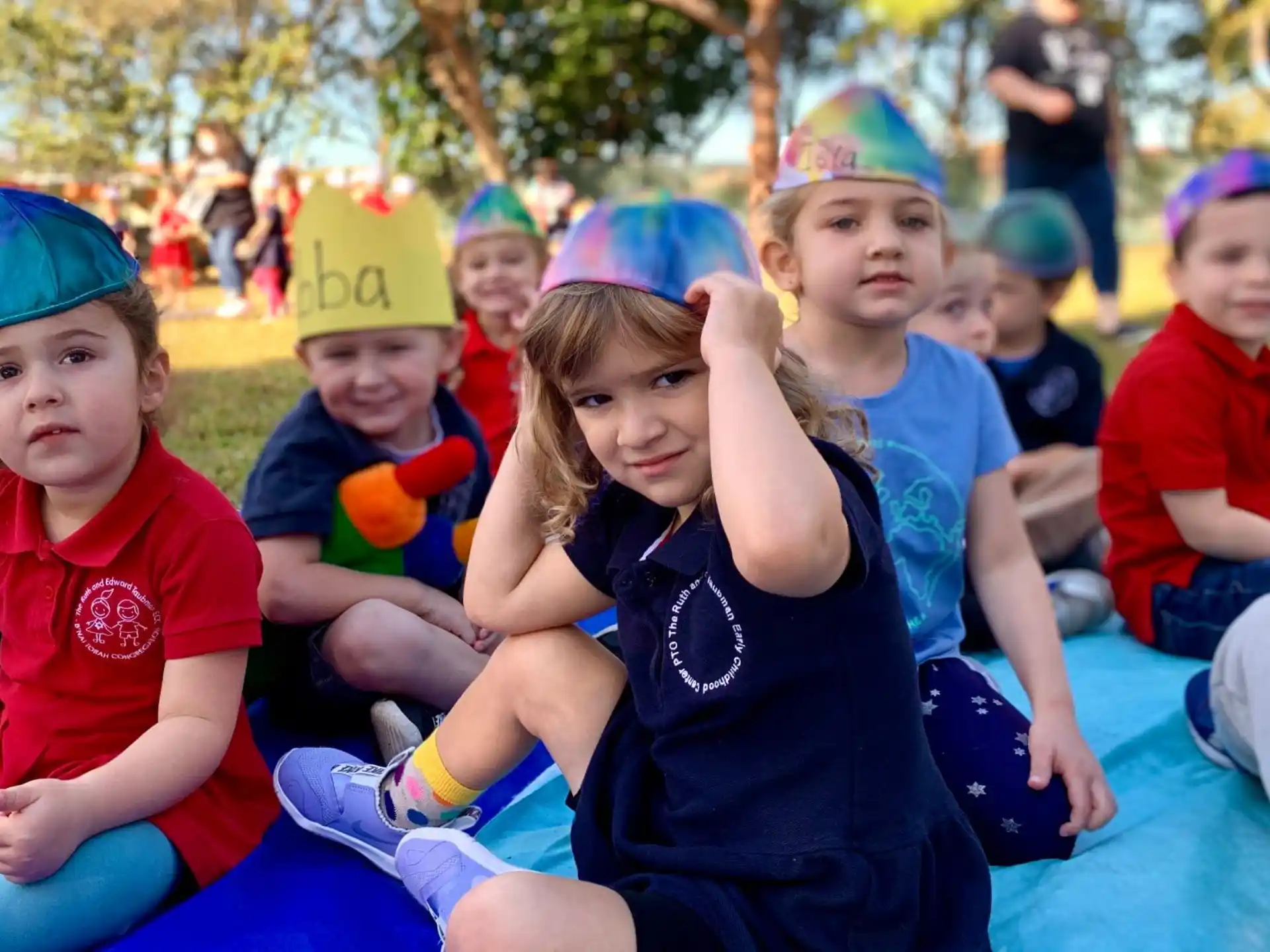 a group of children wearing party hats