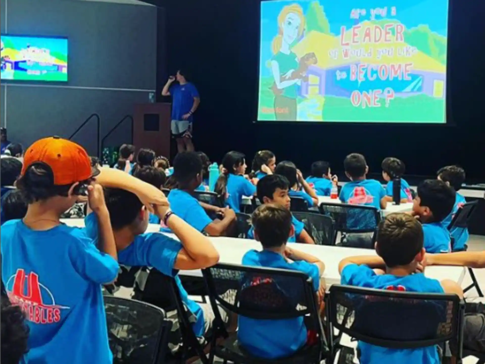 a person giving a presentation to a group of children