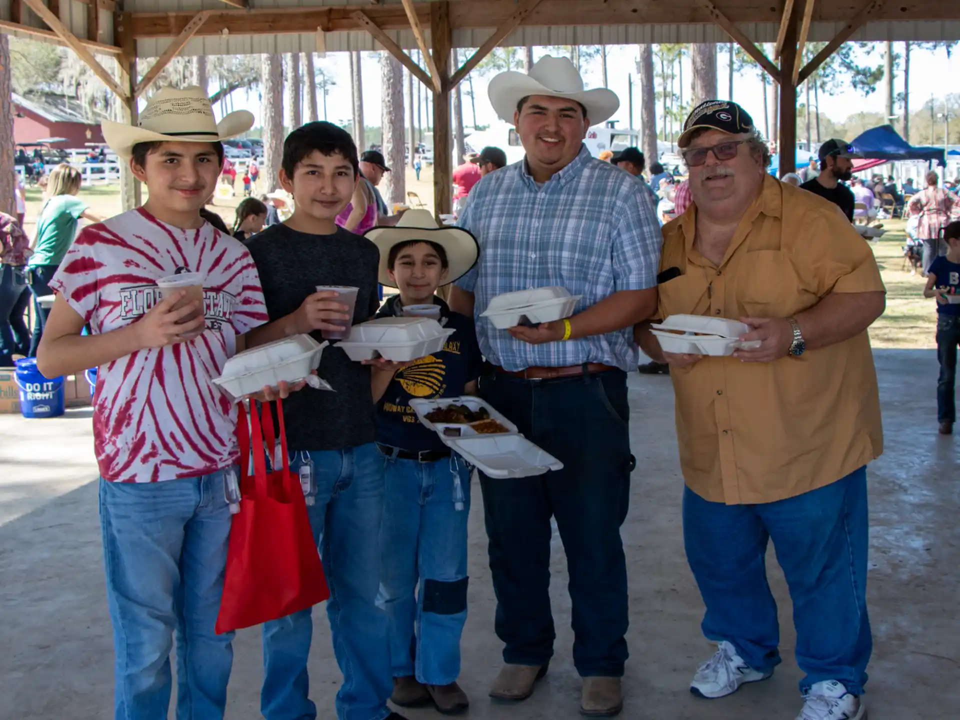 a group of people holding food