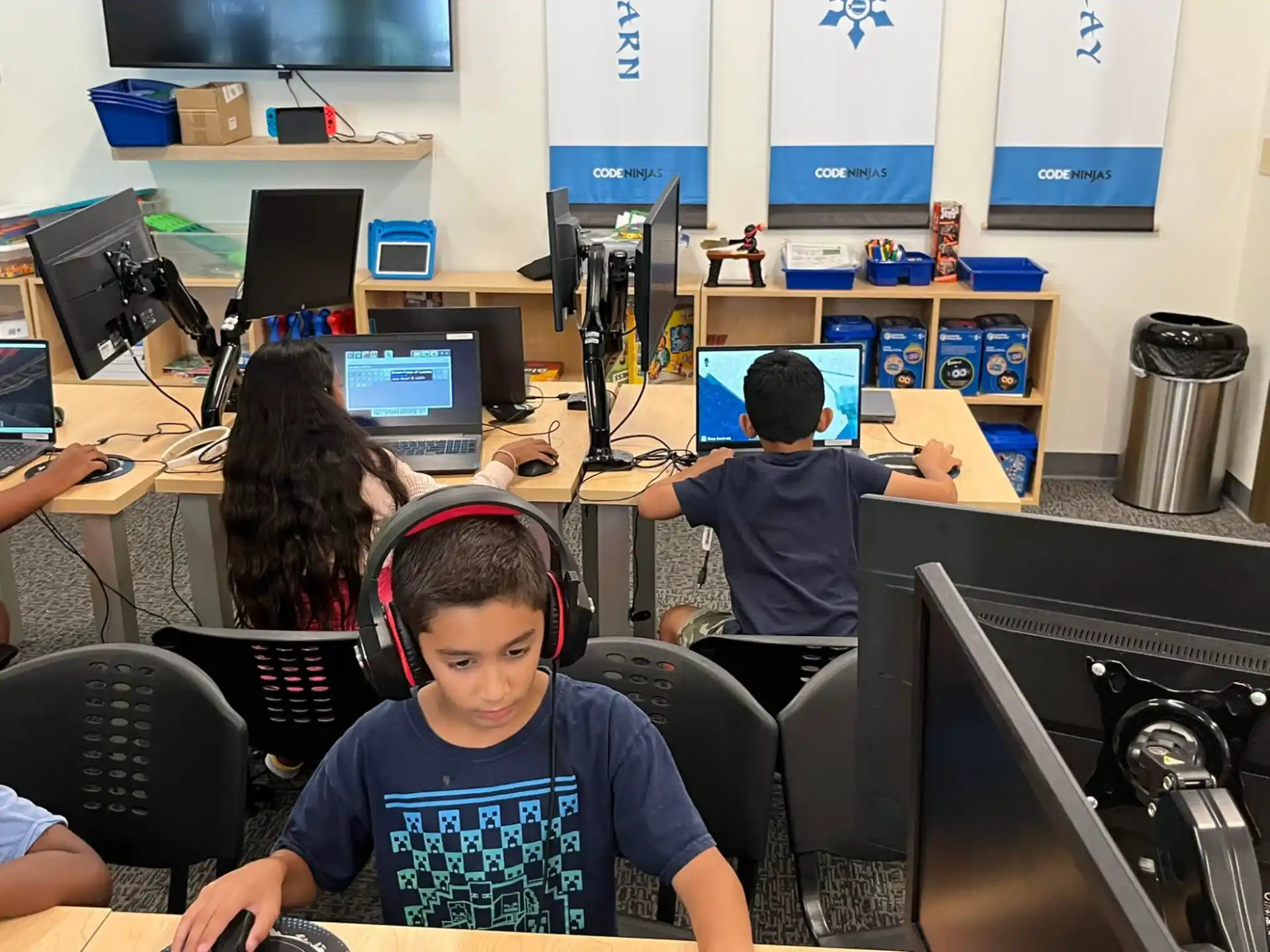 a group of people sitting at computers