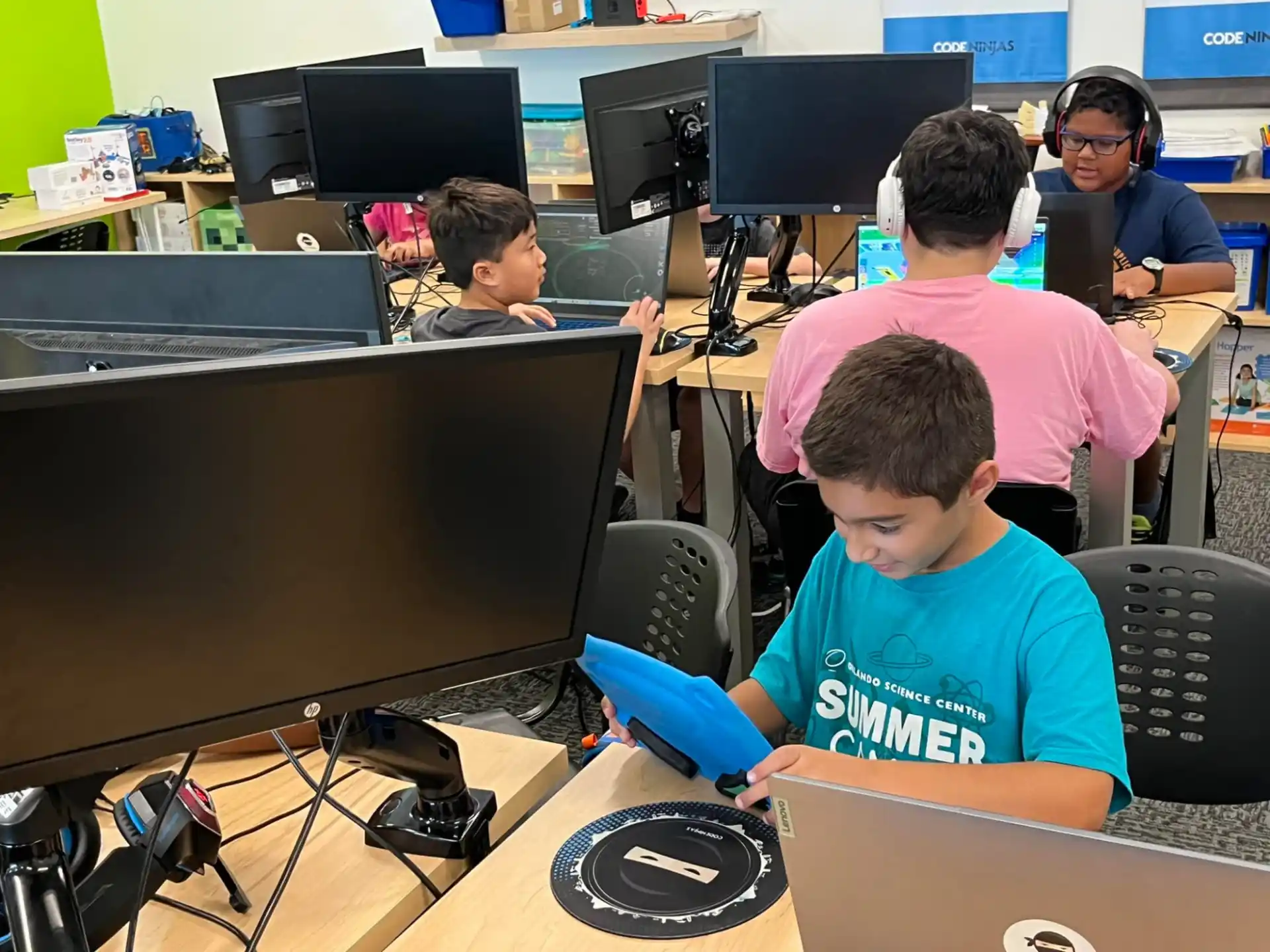 a group of people working on computers