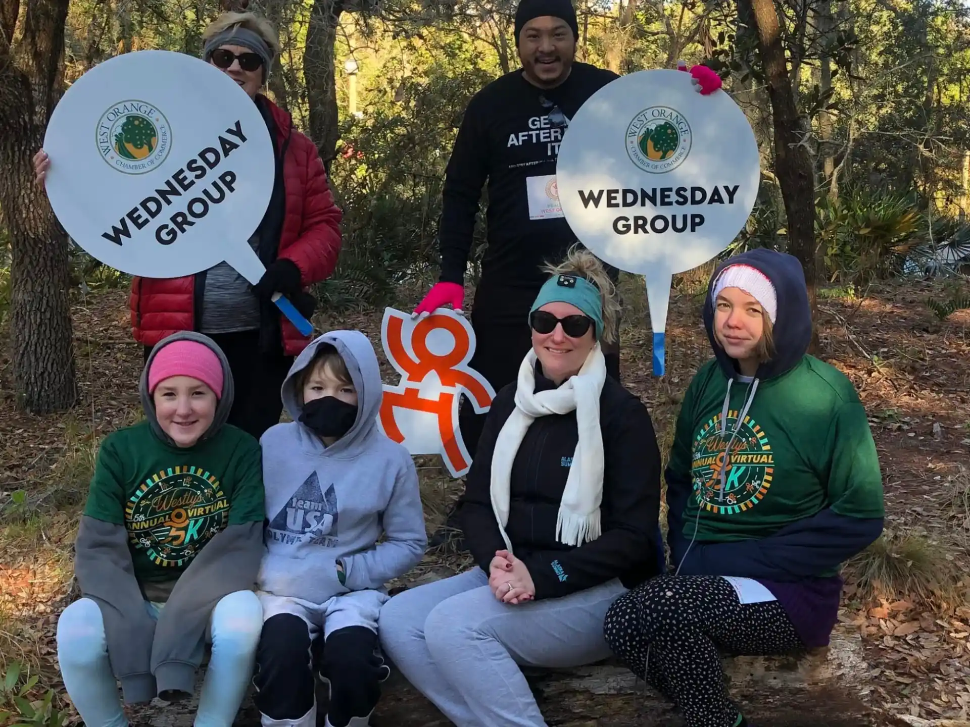 a group of people holding signs