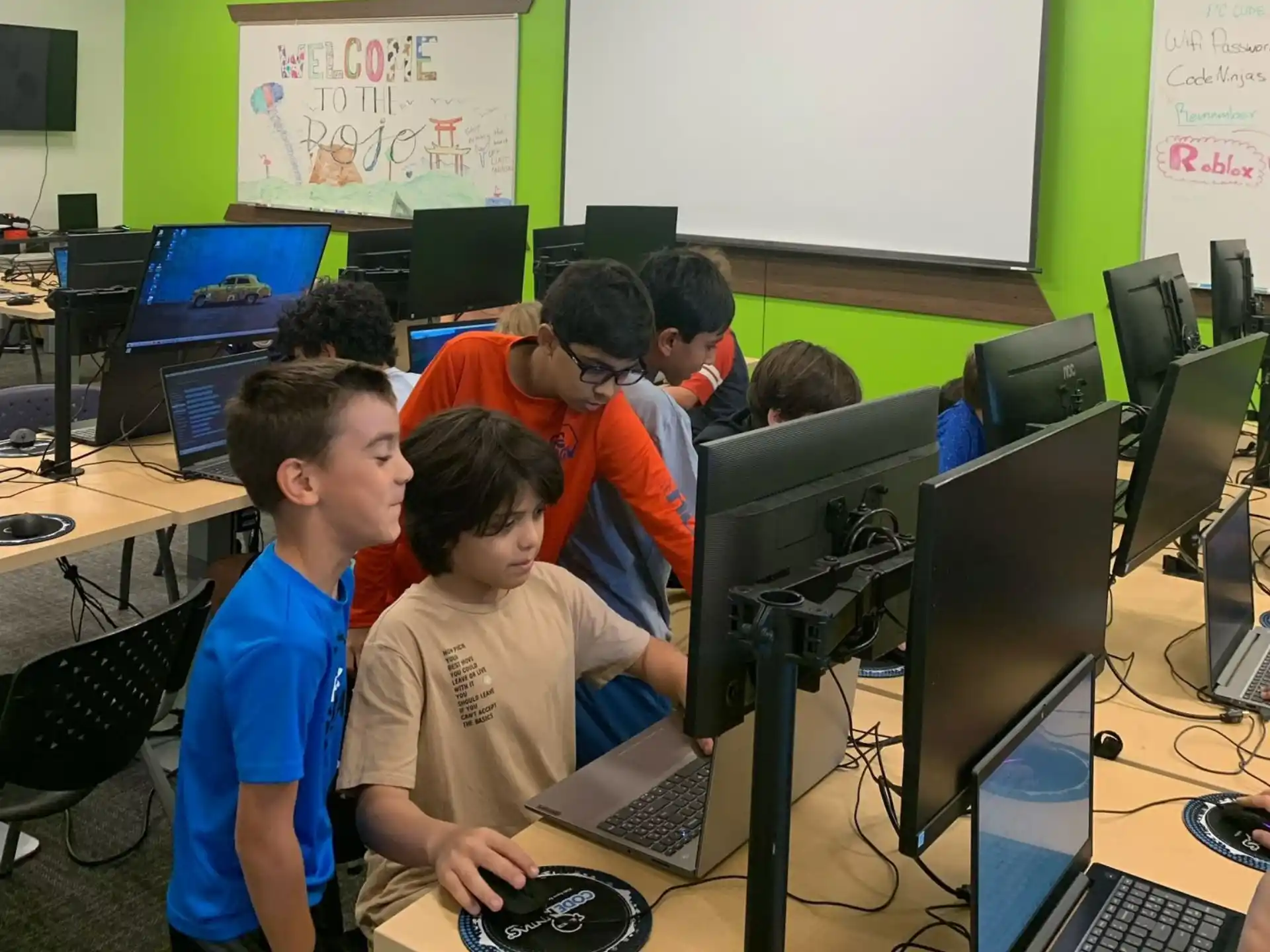 a group of people working on computers