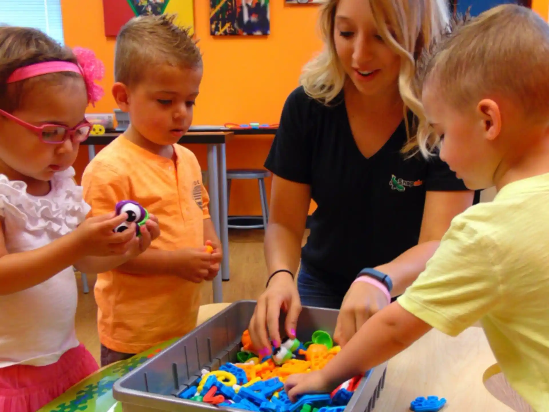 a group of children playing with toys