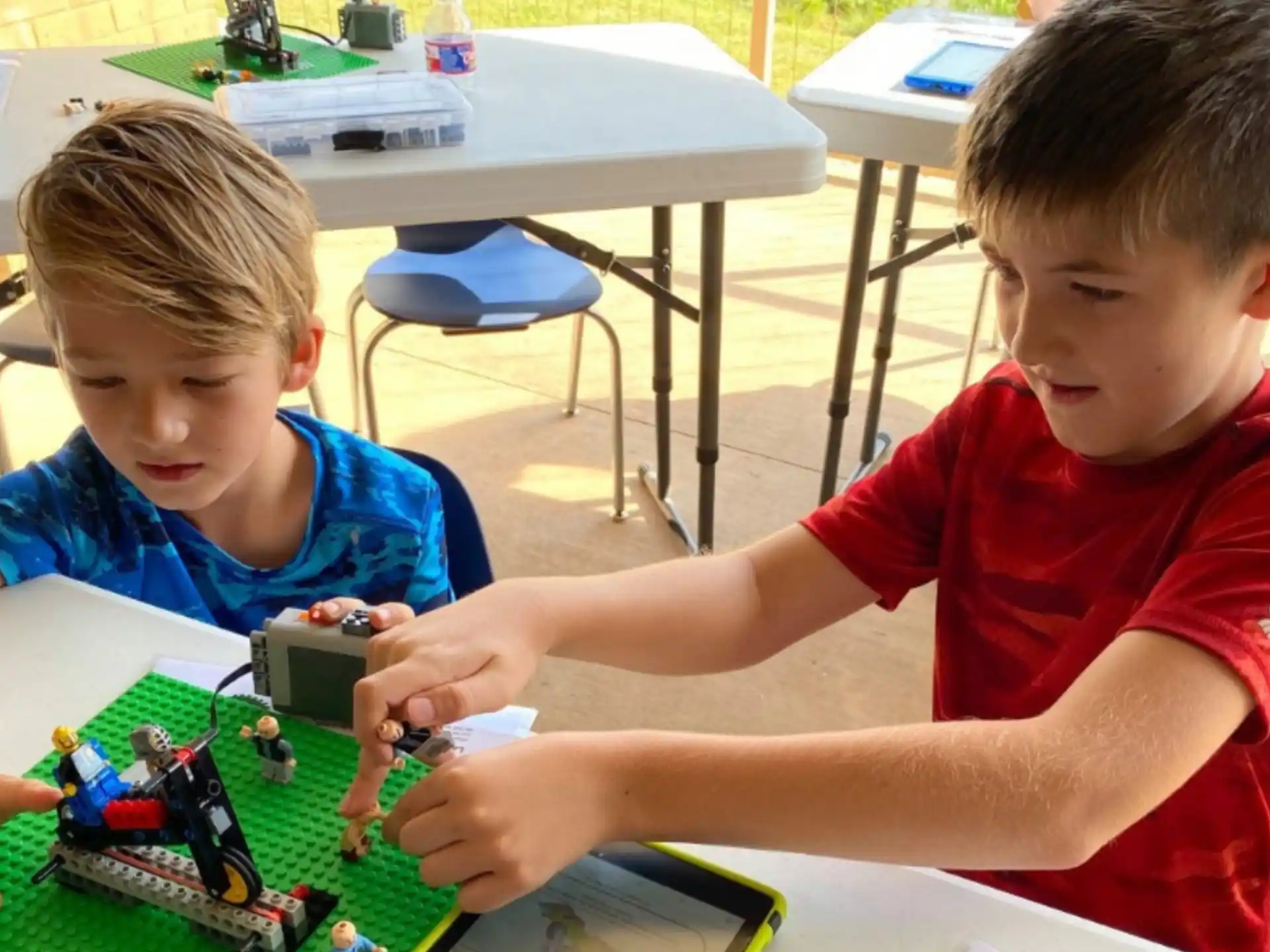 a couple of boys playing with a toy