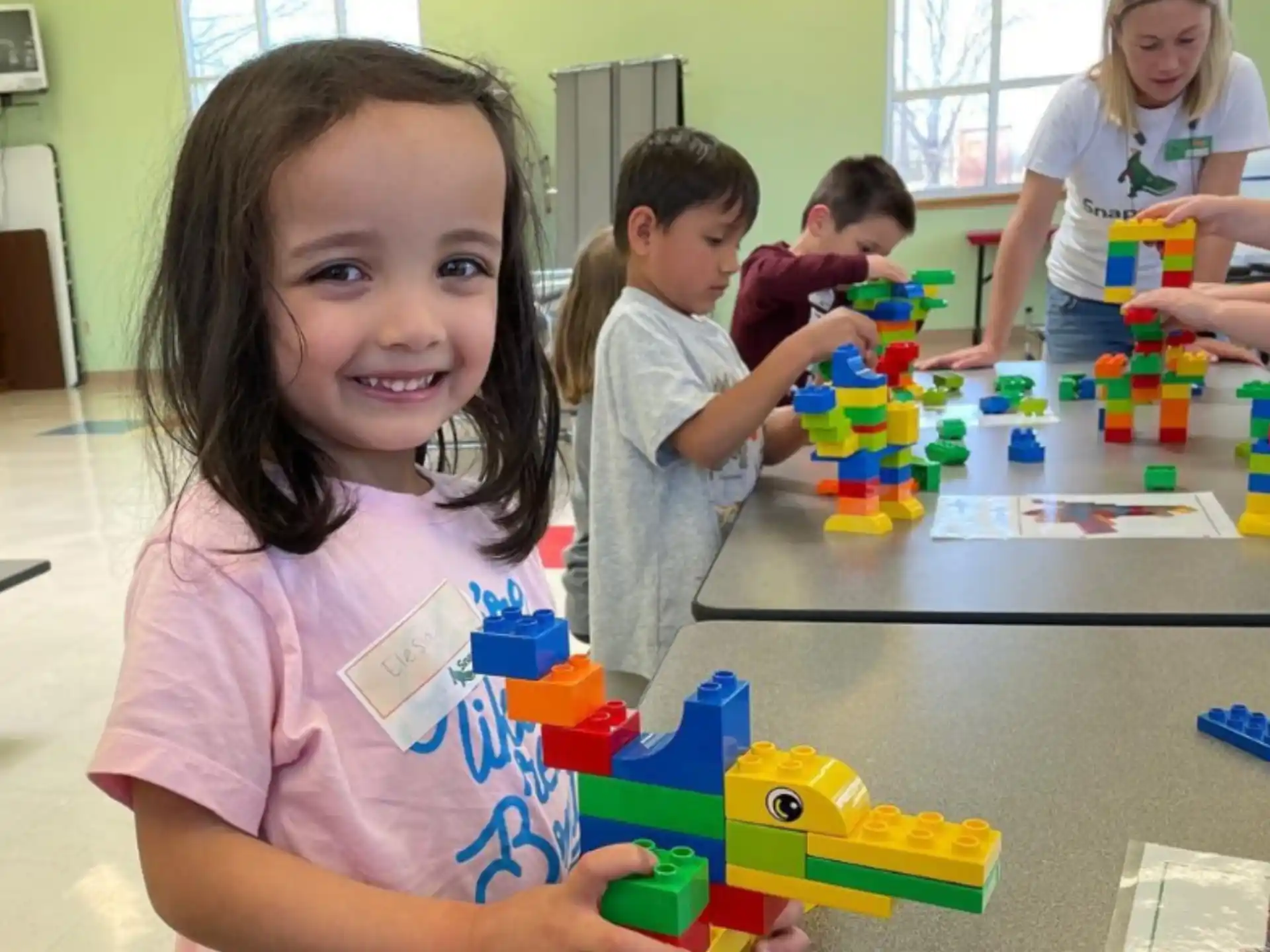 a group of children playing with toys