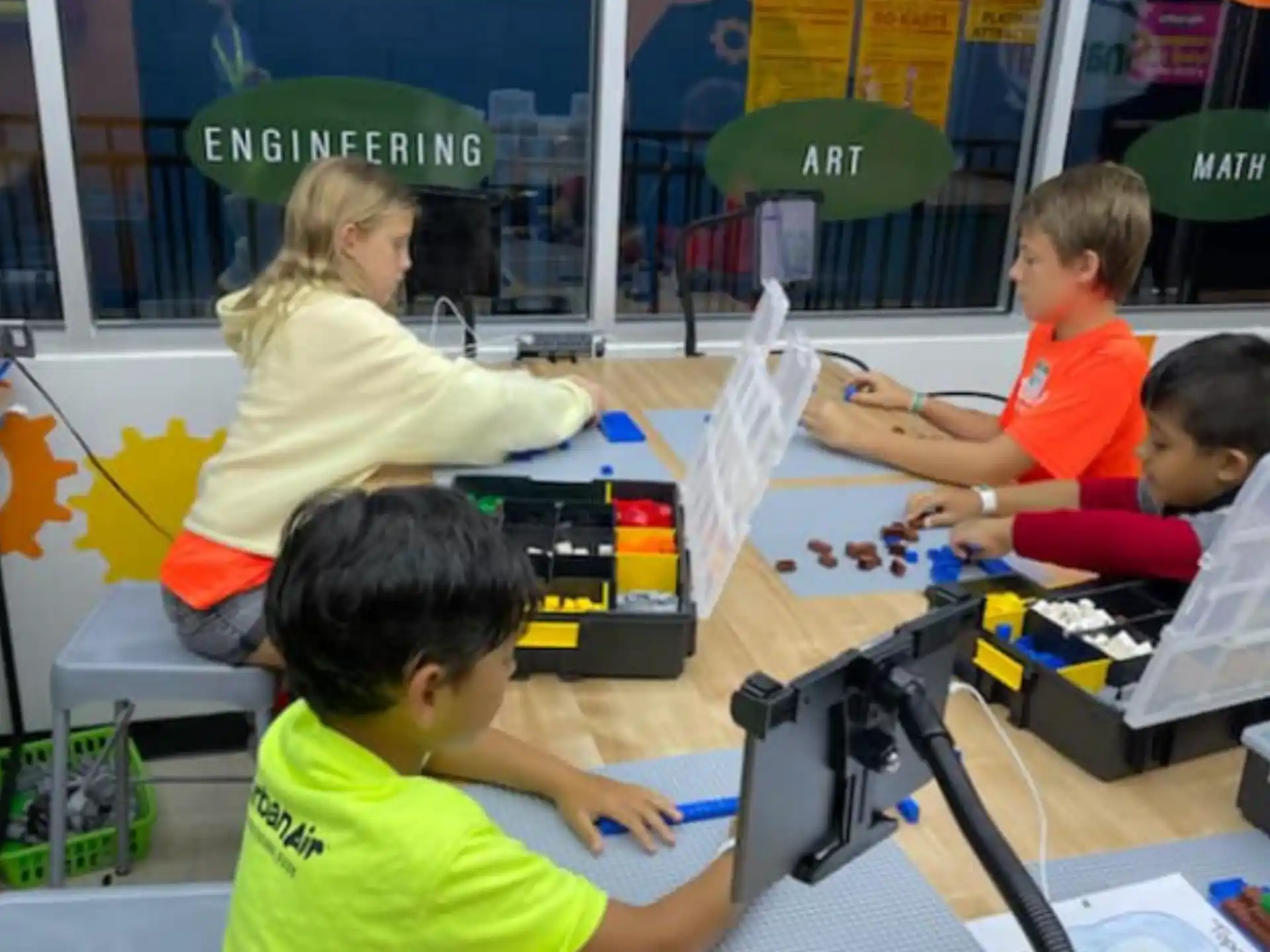 a person and several children working on a project