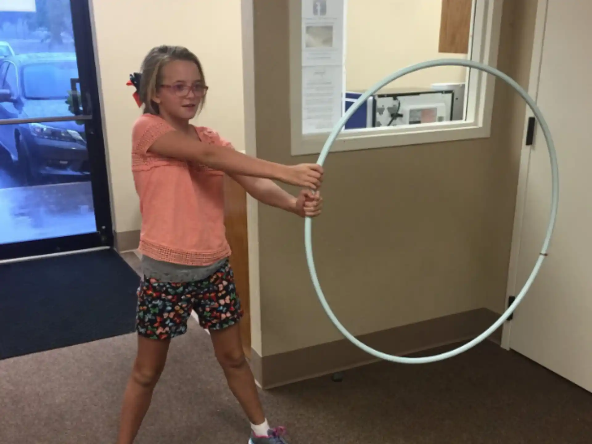 a girl holding a white cord