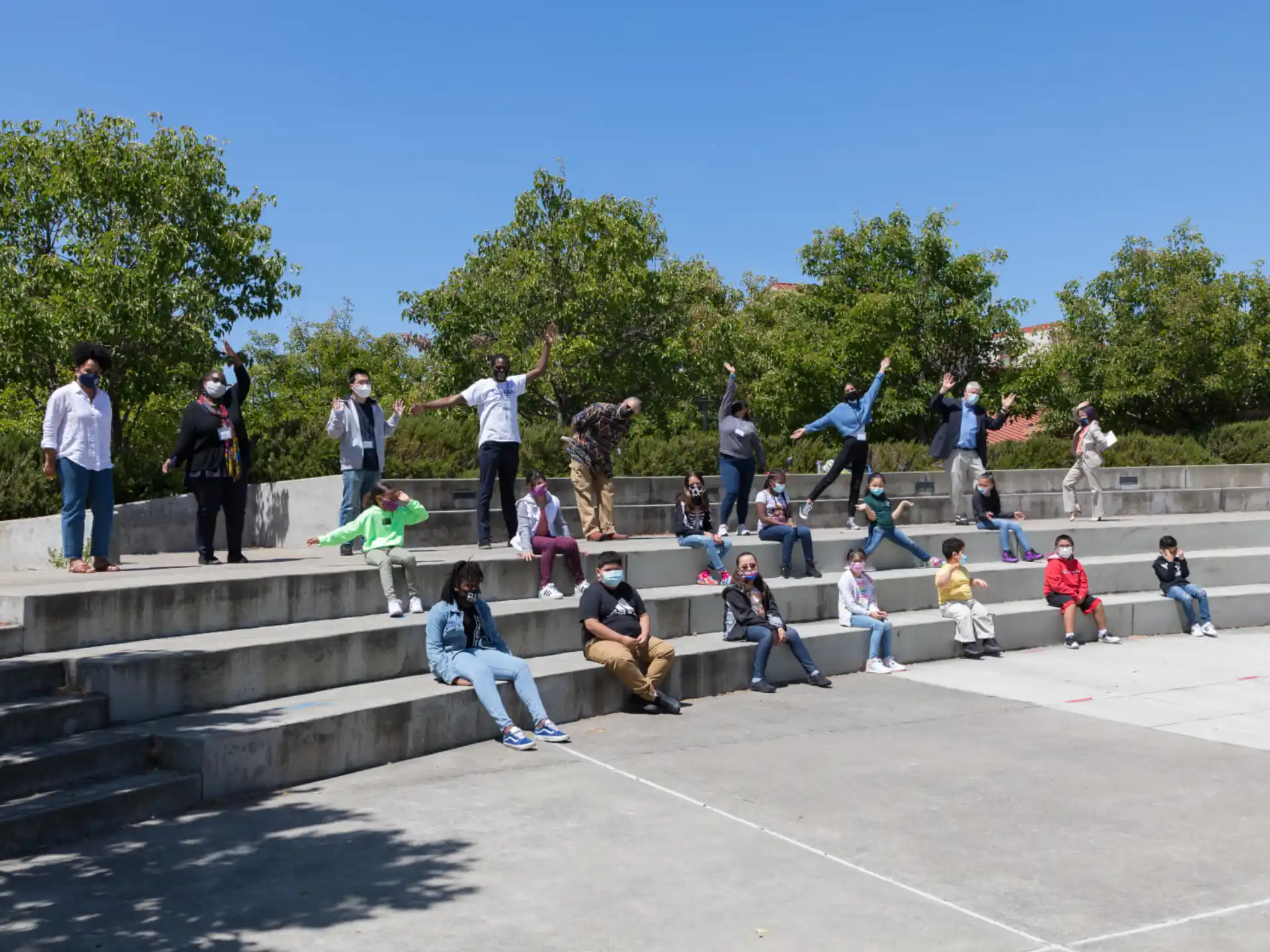 a group of people sitting on stairs