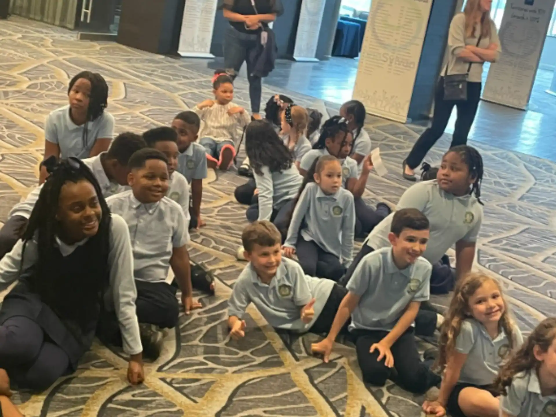 a group of people sitting on the floor