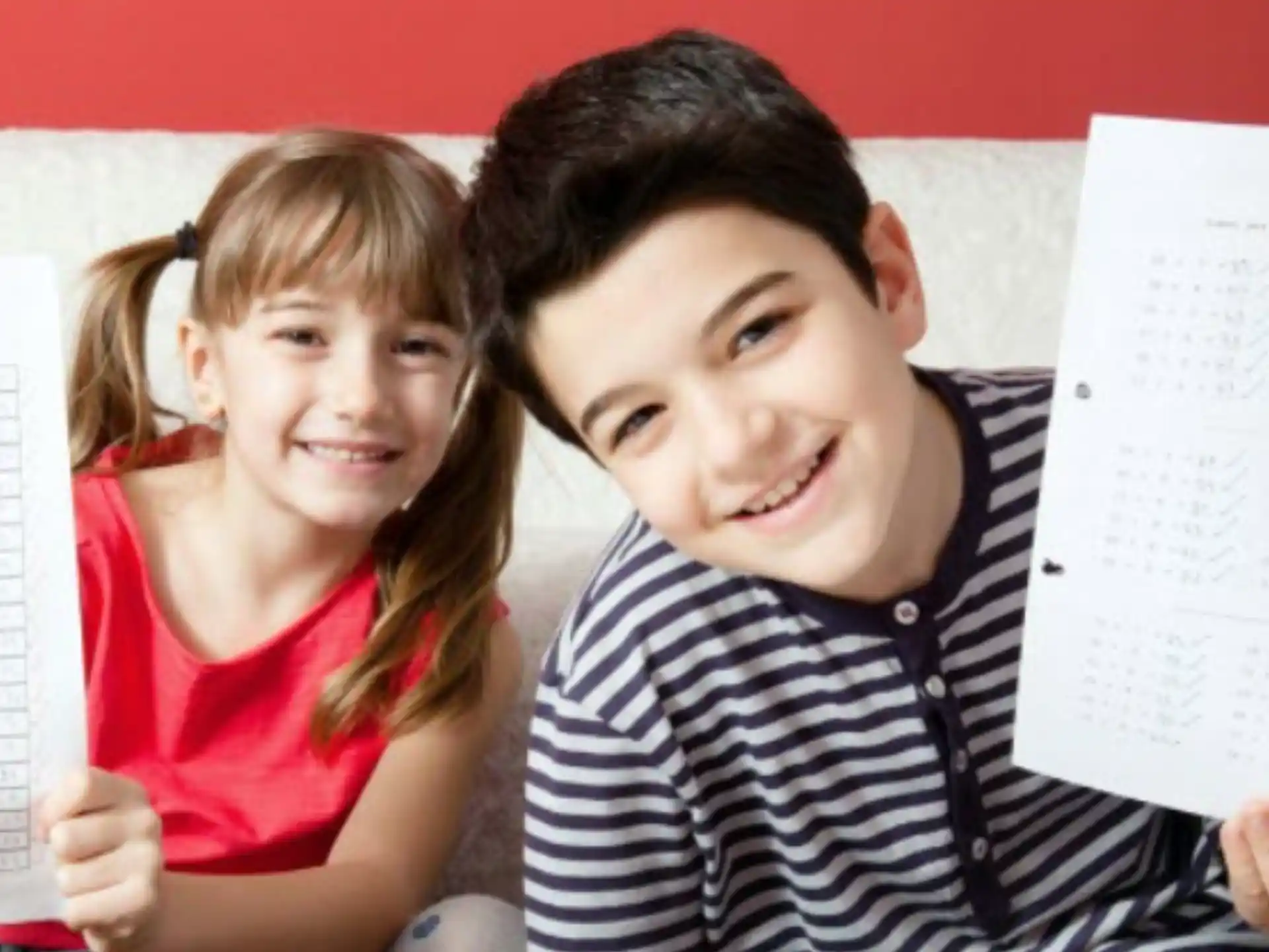 a person and a girl looking at a paper