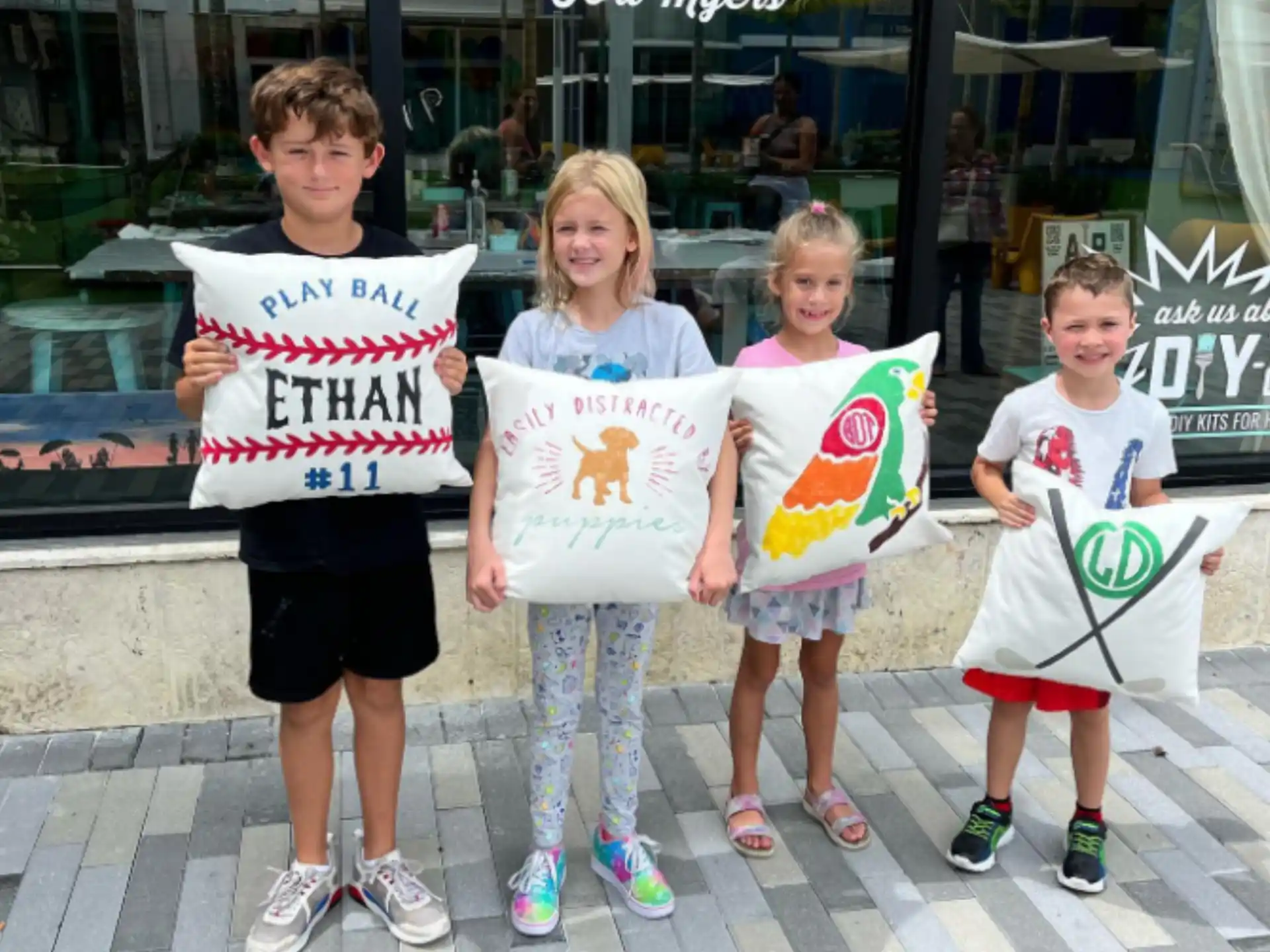 a group of children holding signs