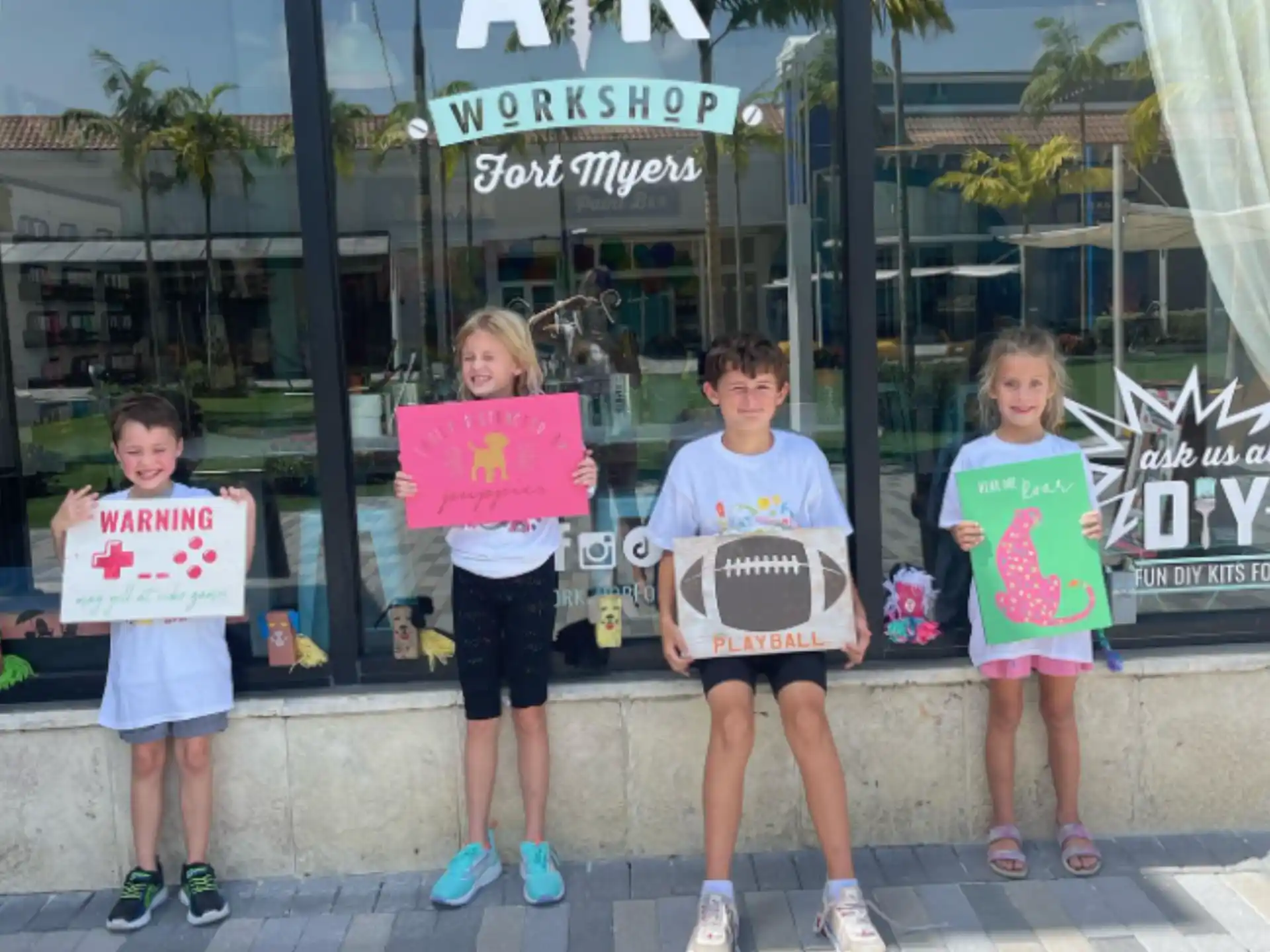 a group of kids holding signs