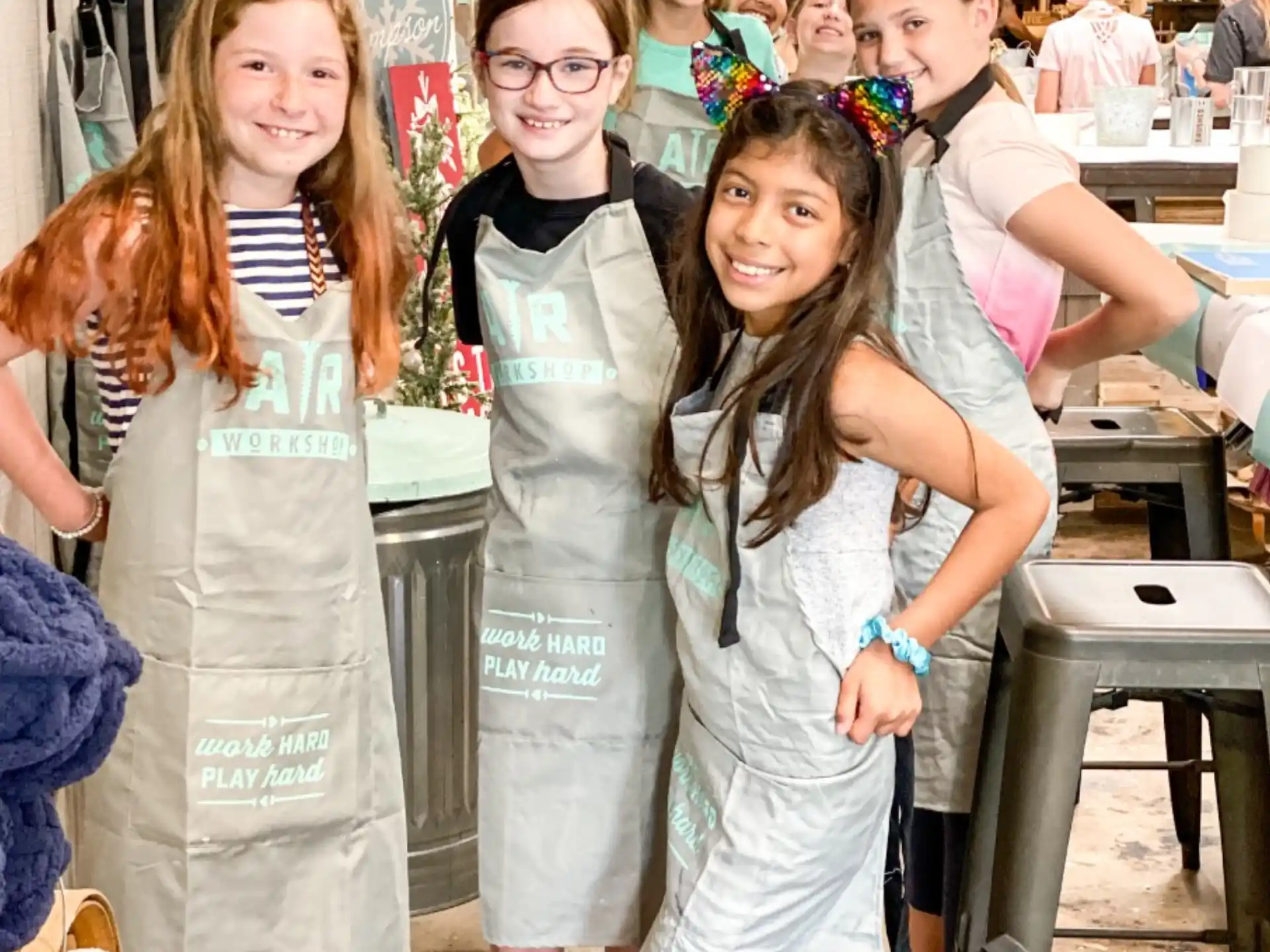a group of girls in white dresses