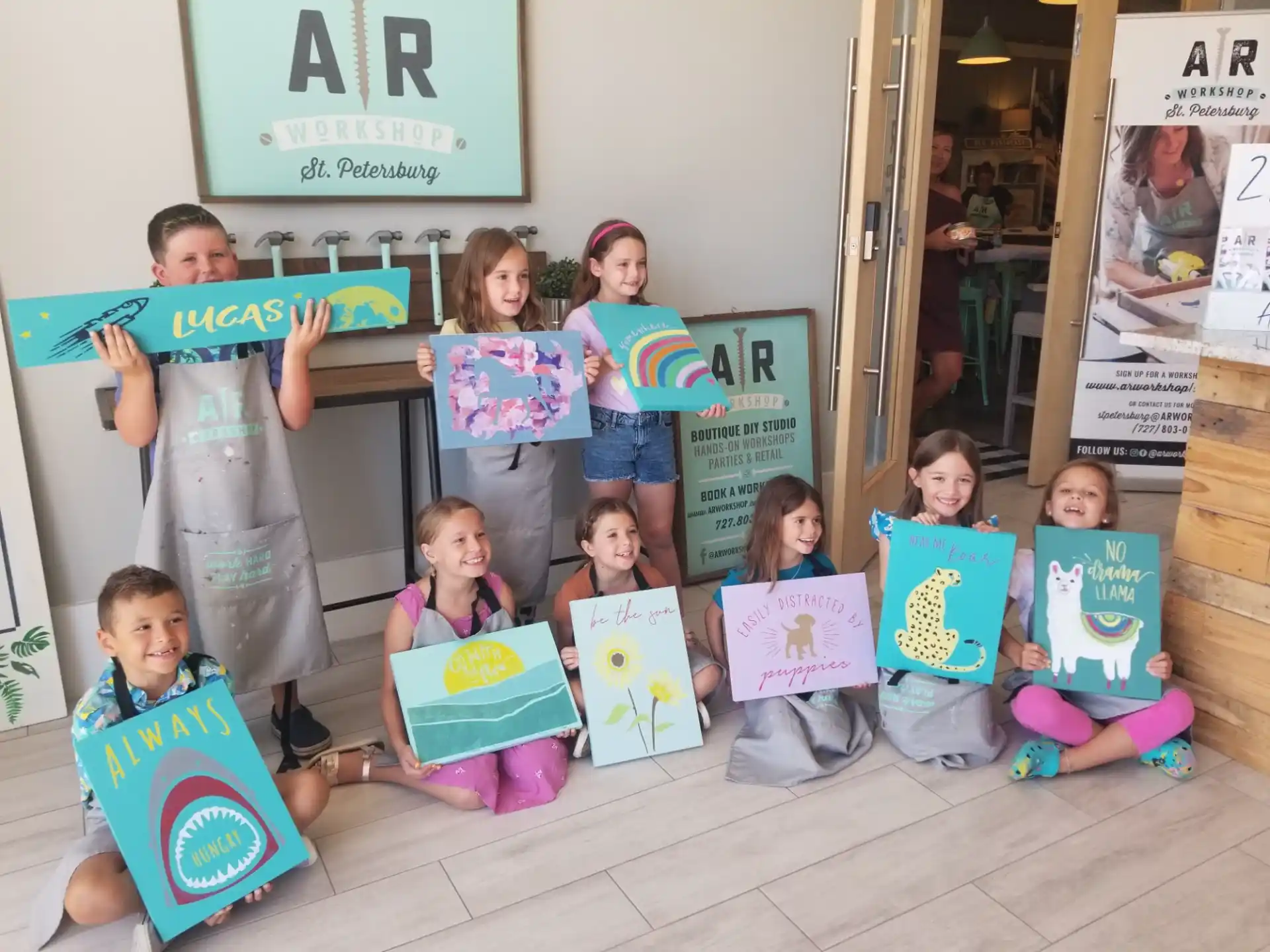 a group of children holding up books