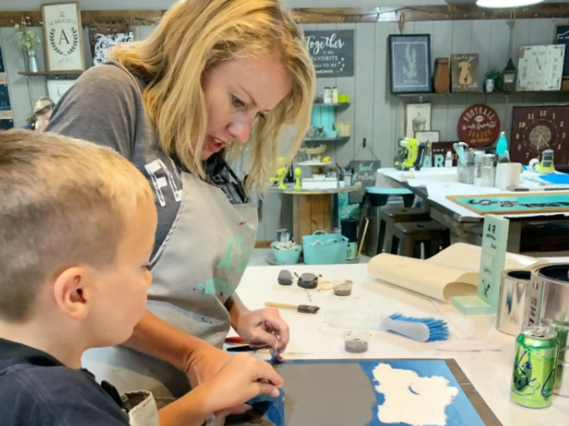 a person and a boy painting
