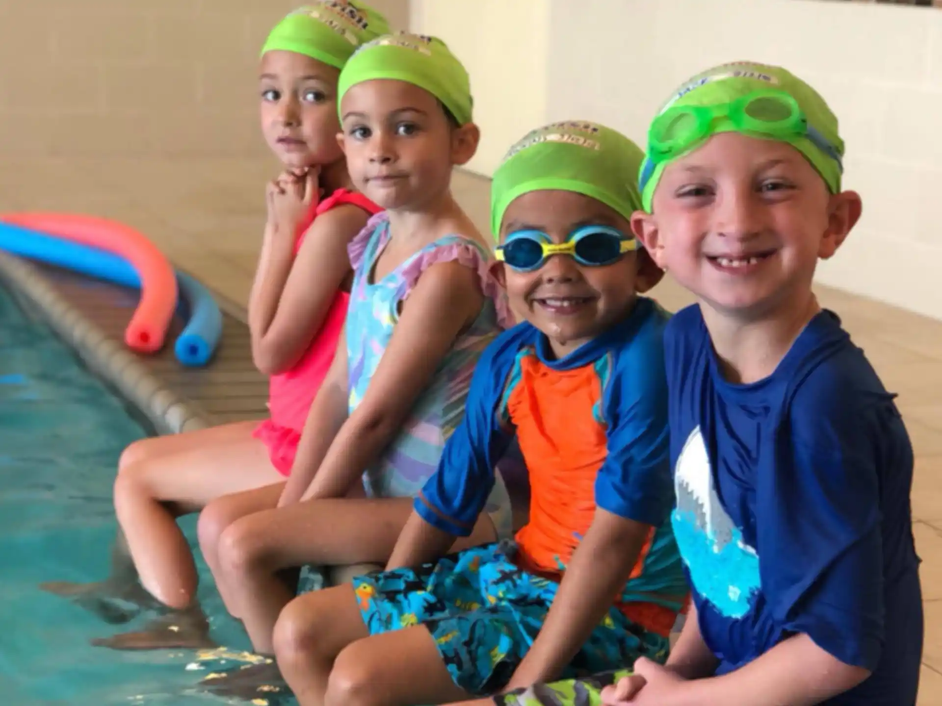 a group of kids in a pool