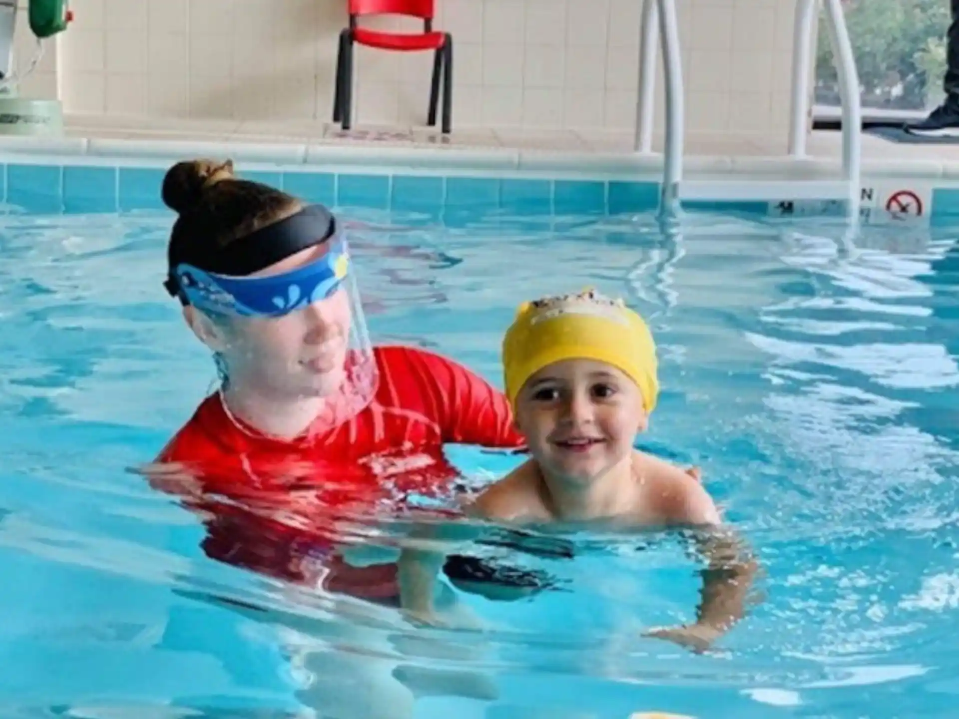 a couple of people in a pool
