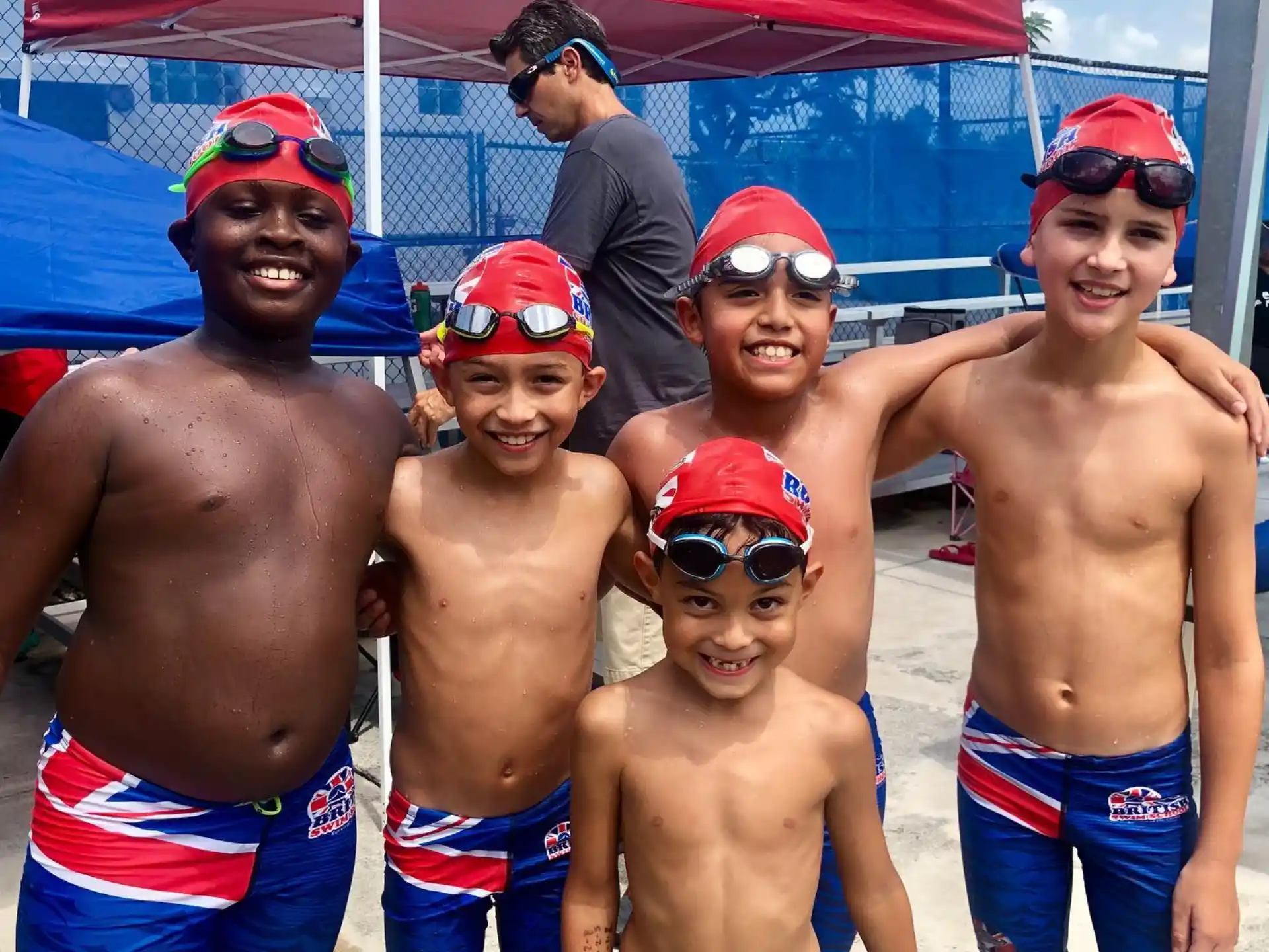 a group of men wearing swimsuits and hats