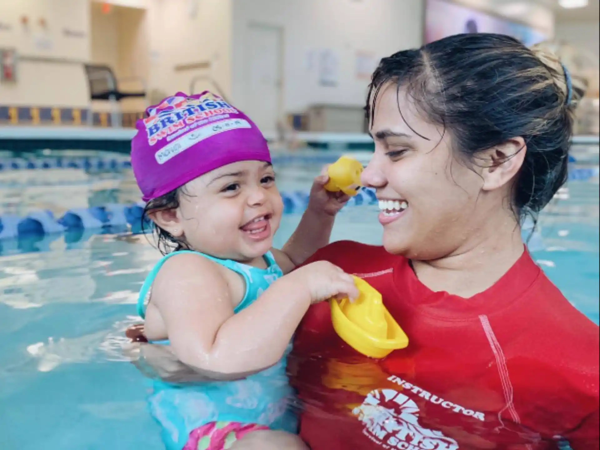 a person and a child in a pool