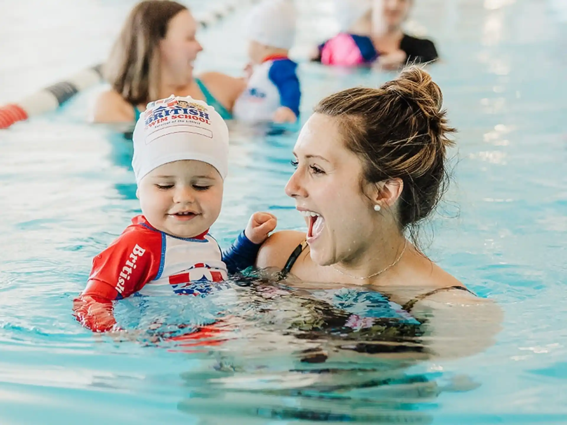 a person and a child in a pool