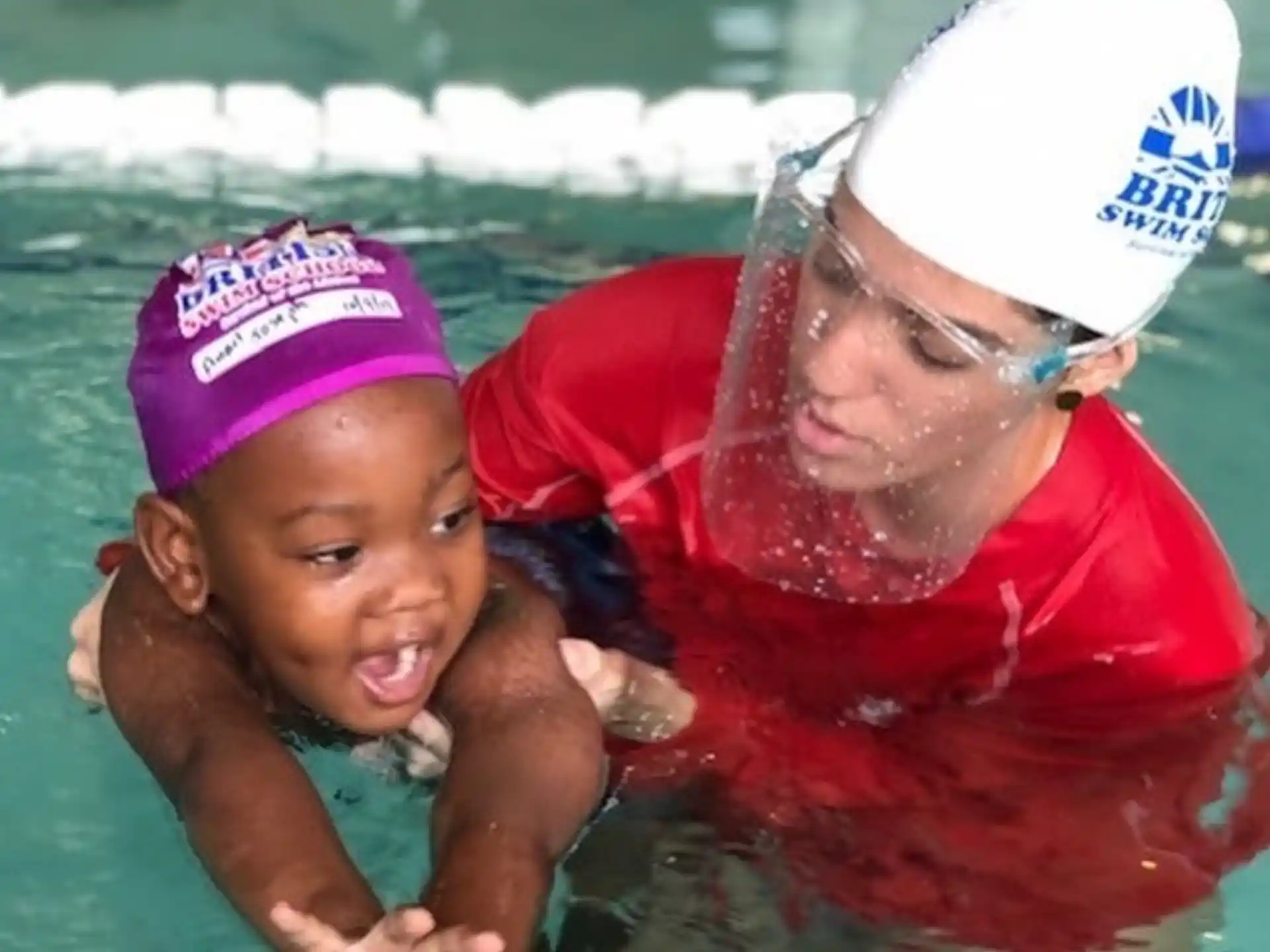 a person and a child in a pool