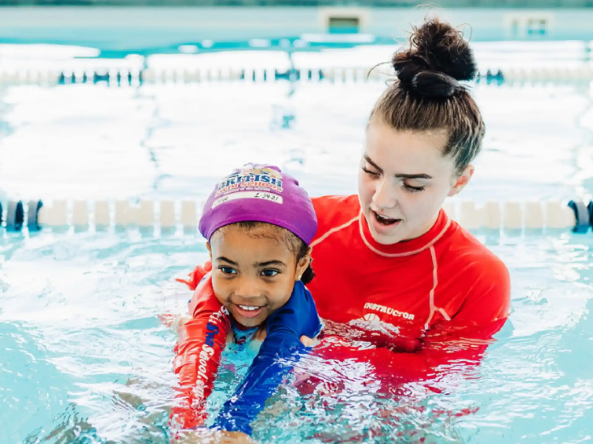 a person and a child in a pool