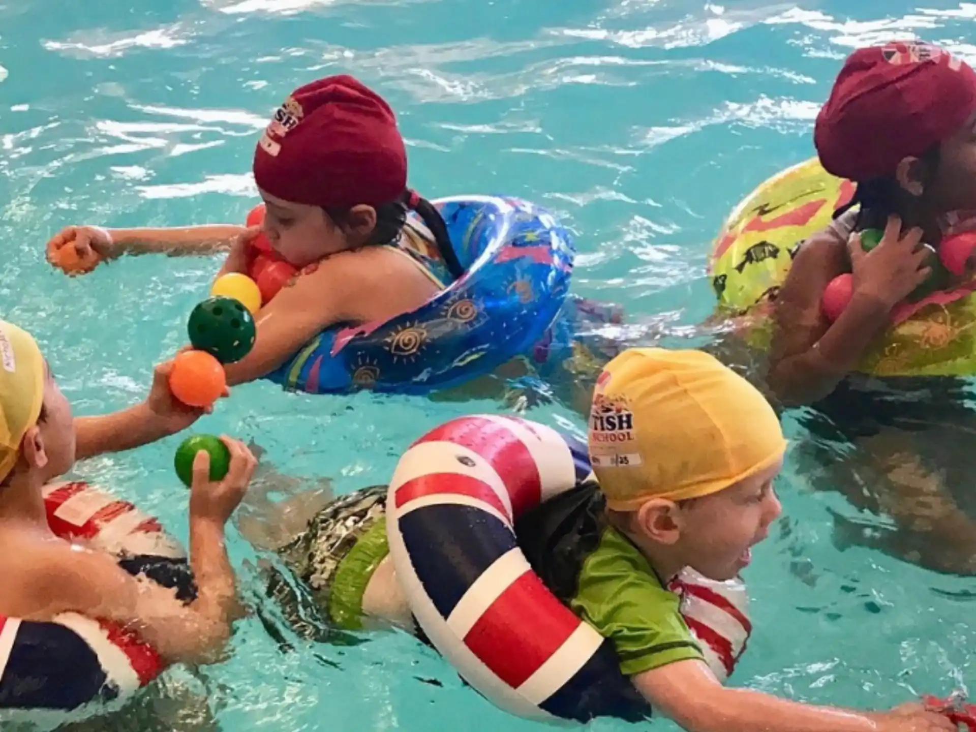 a group of kids in a pool