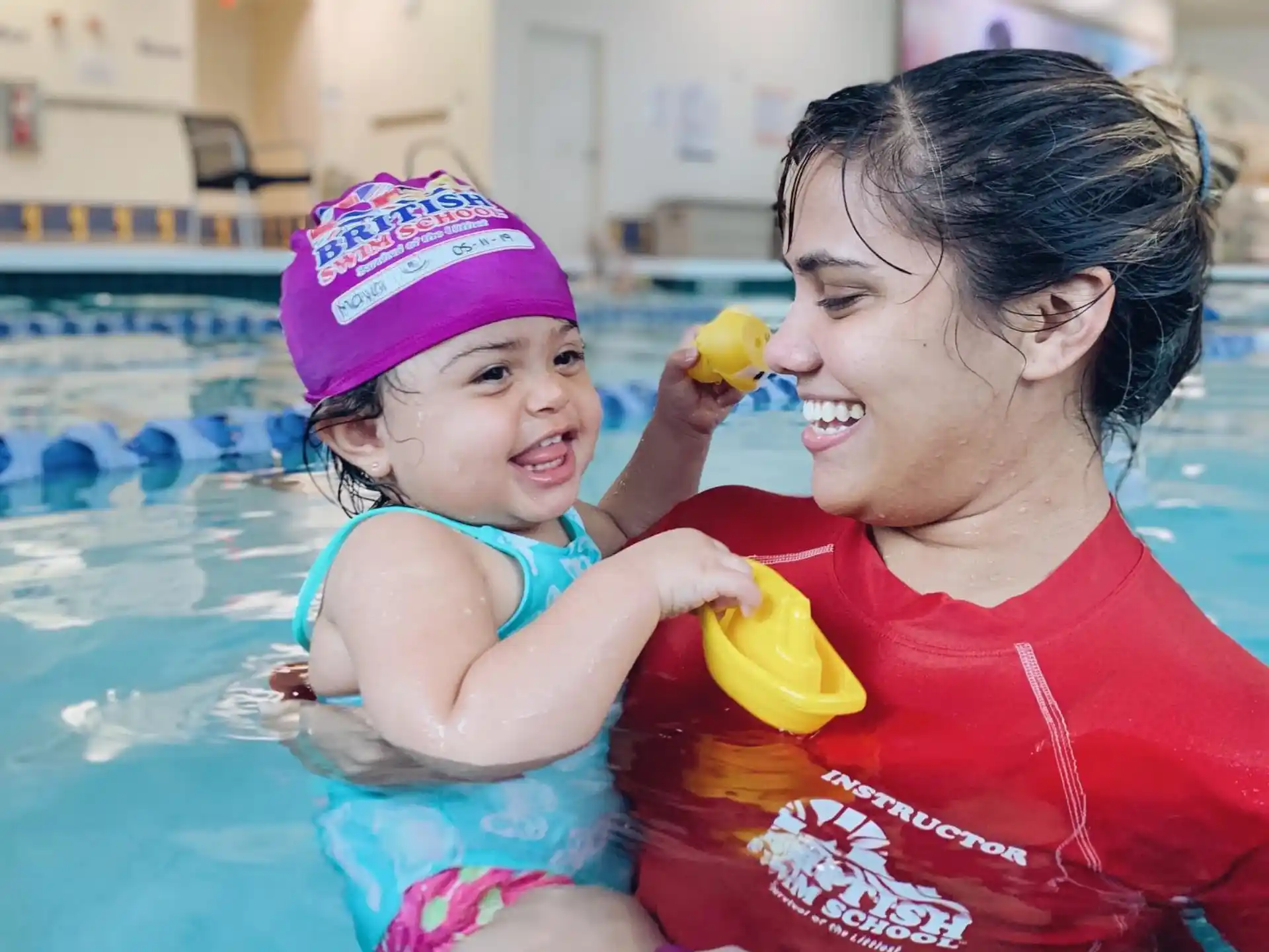 a person and a child in a pool