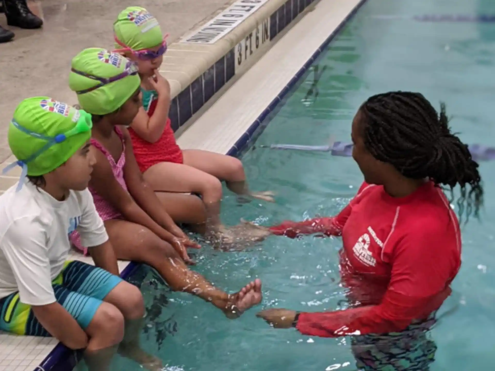 a group of children in a pool