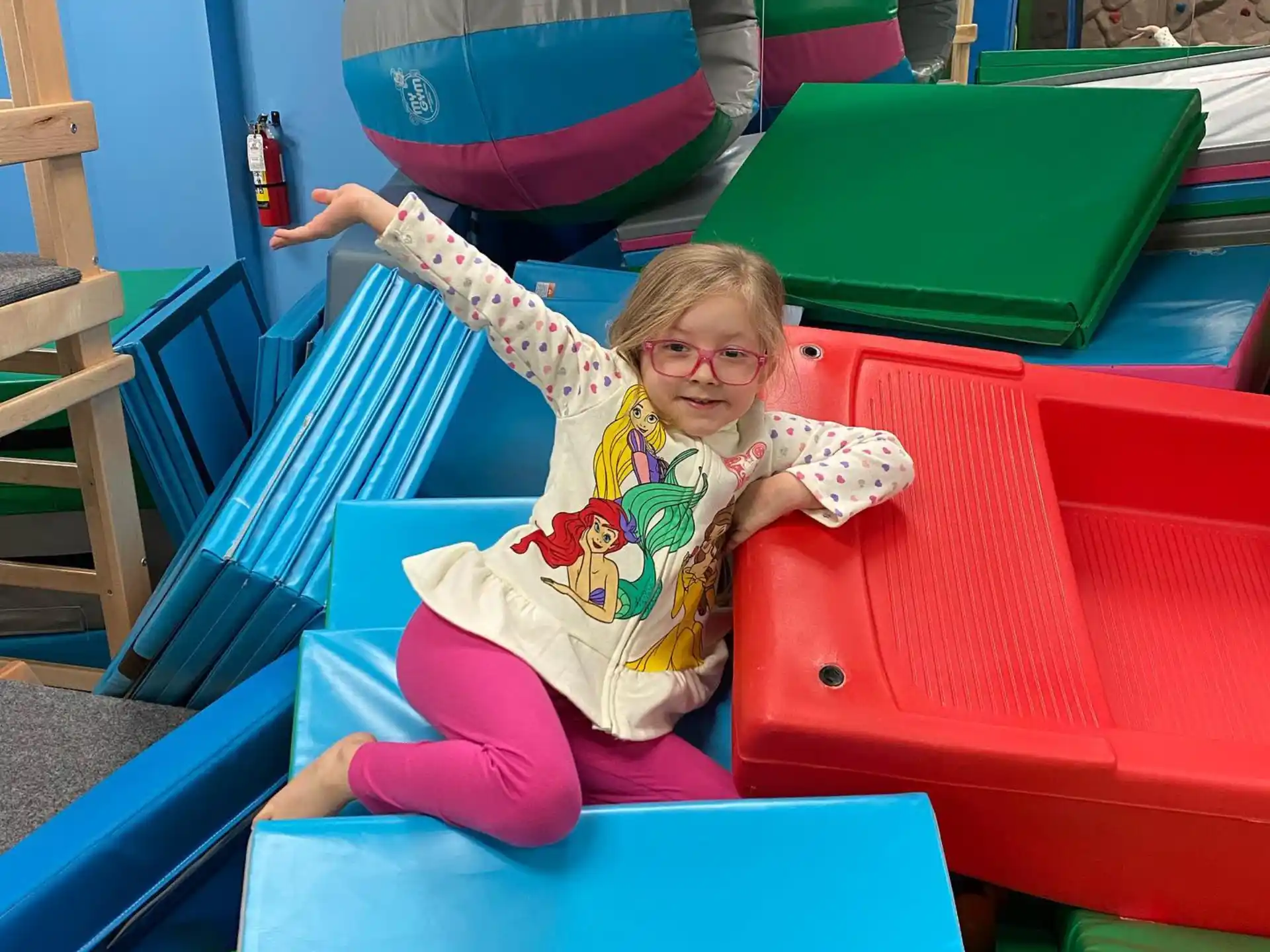 a girl sitting on a slide