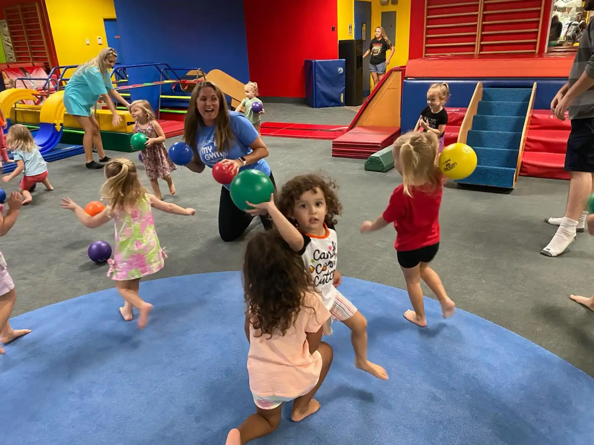 a group of children playing in a gym