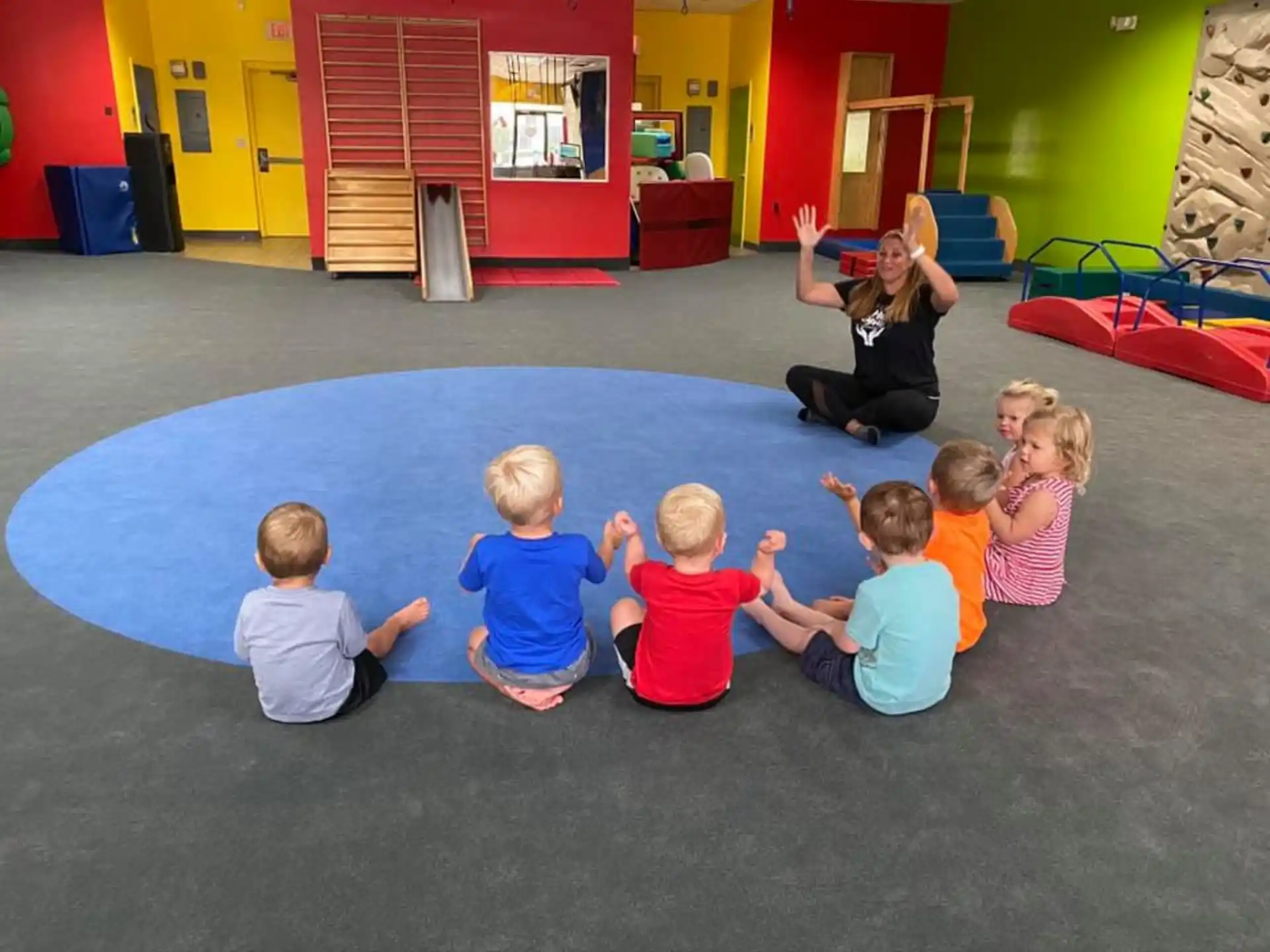 a group of children sitting on the floor