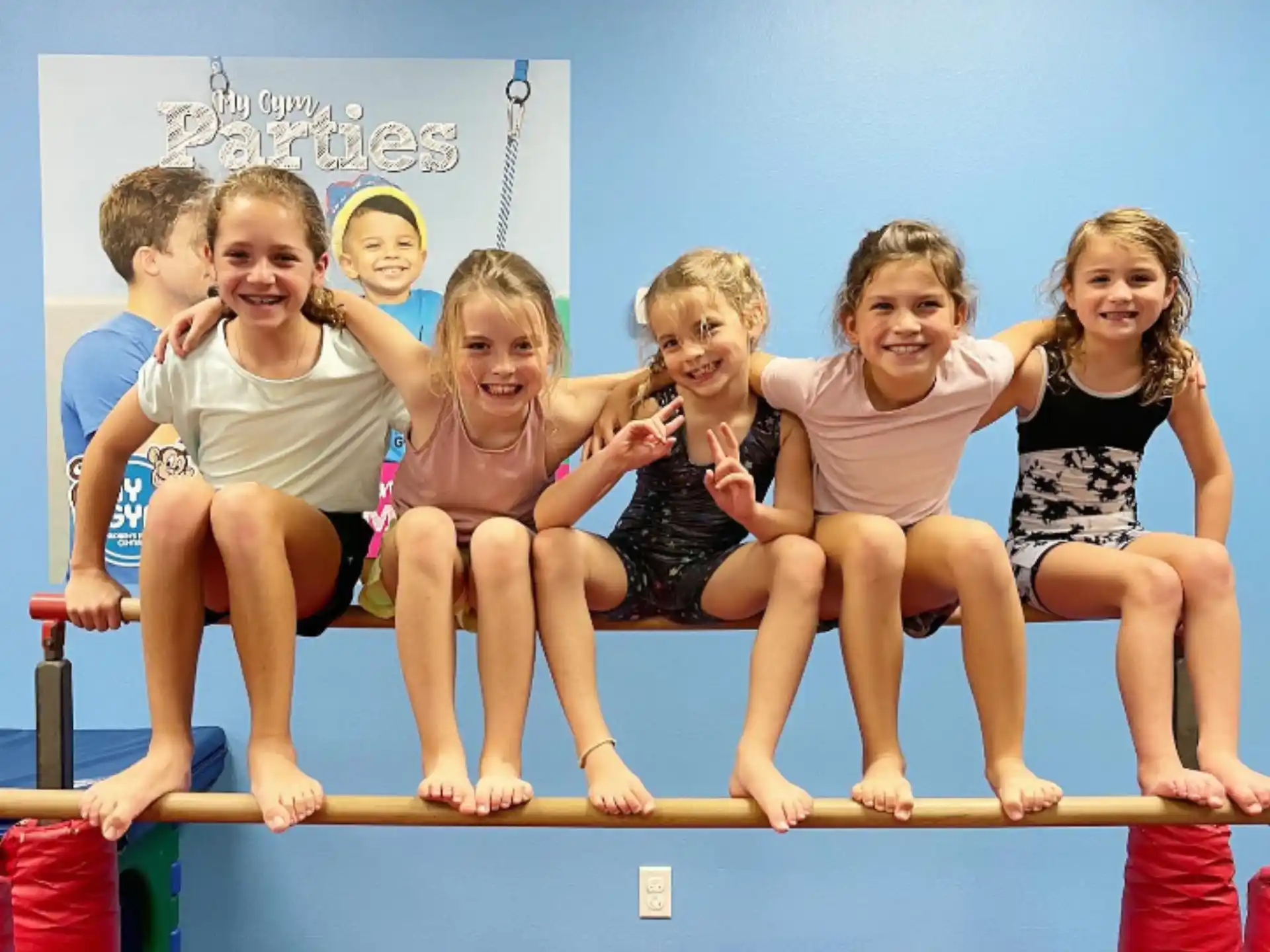 a group of children on a bar