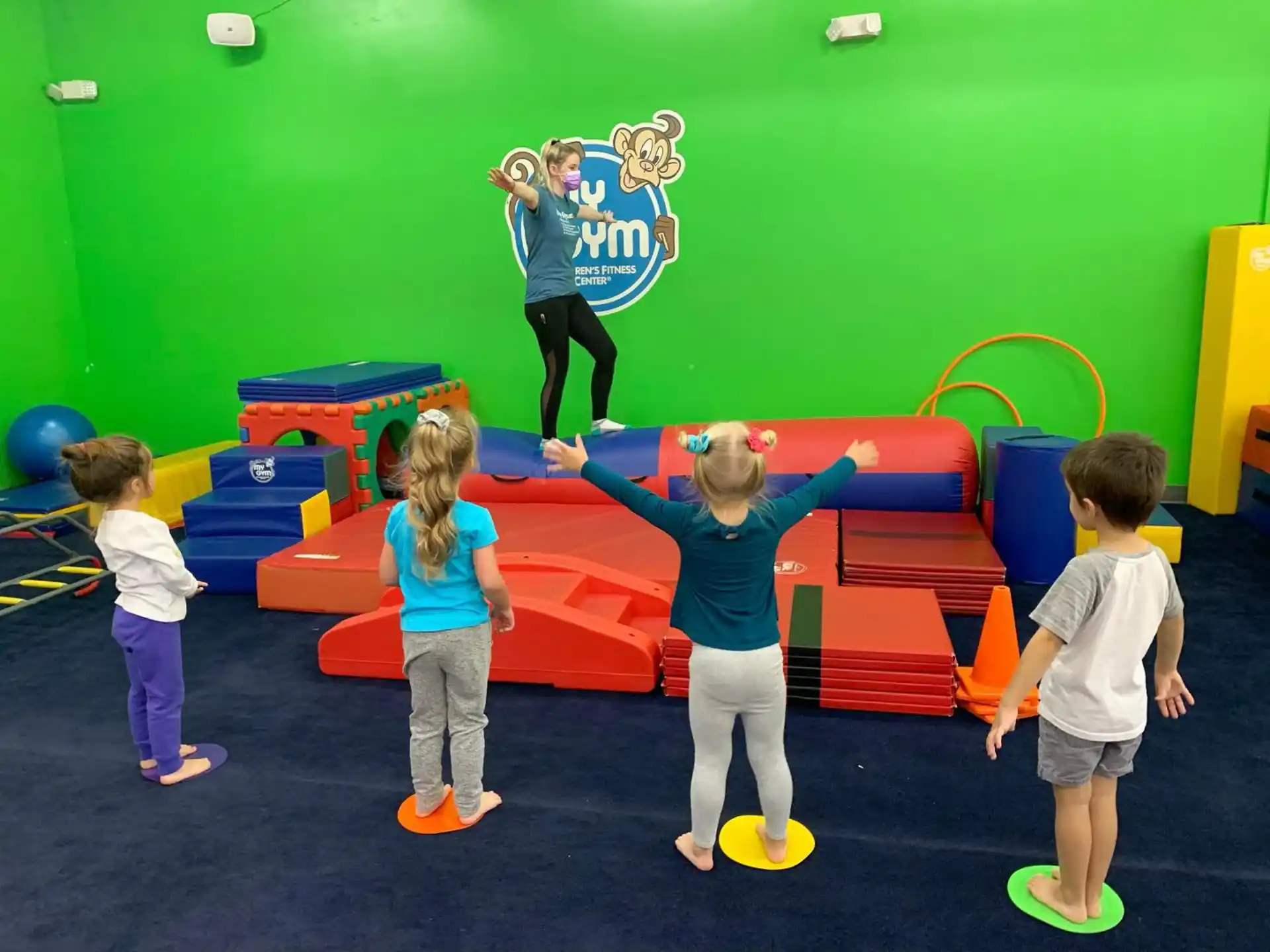 a group of children playing on a playground