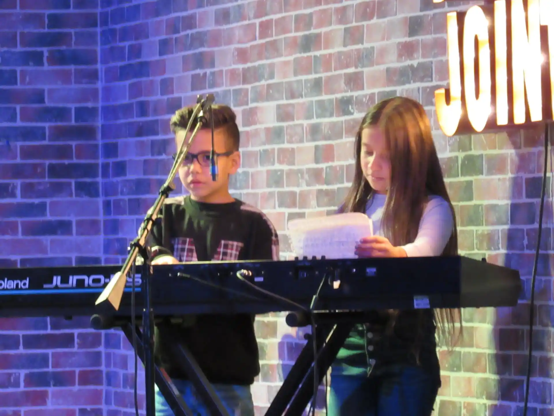 a man and woman playing piano