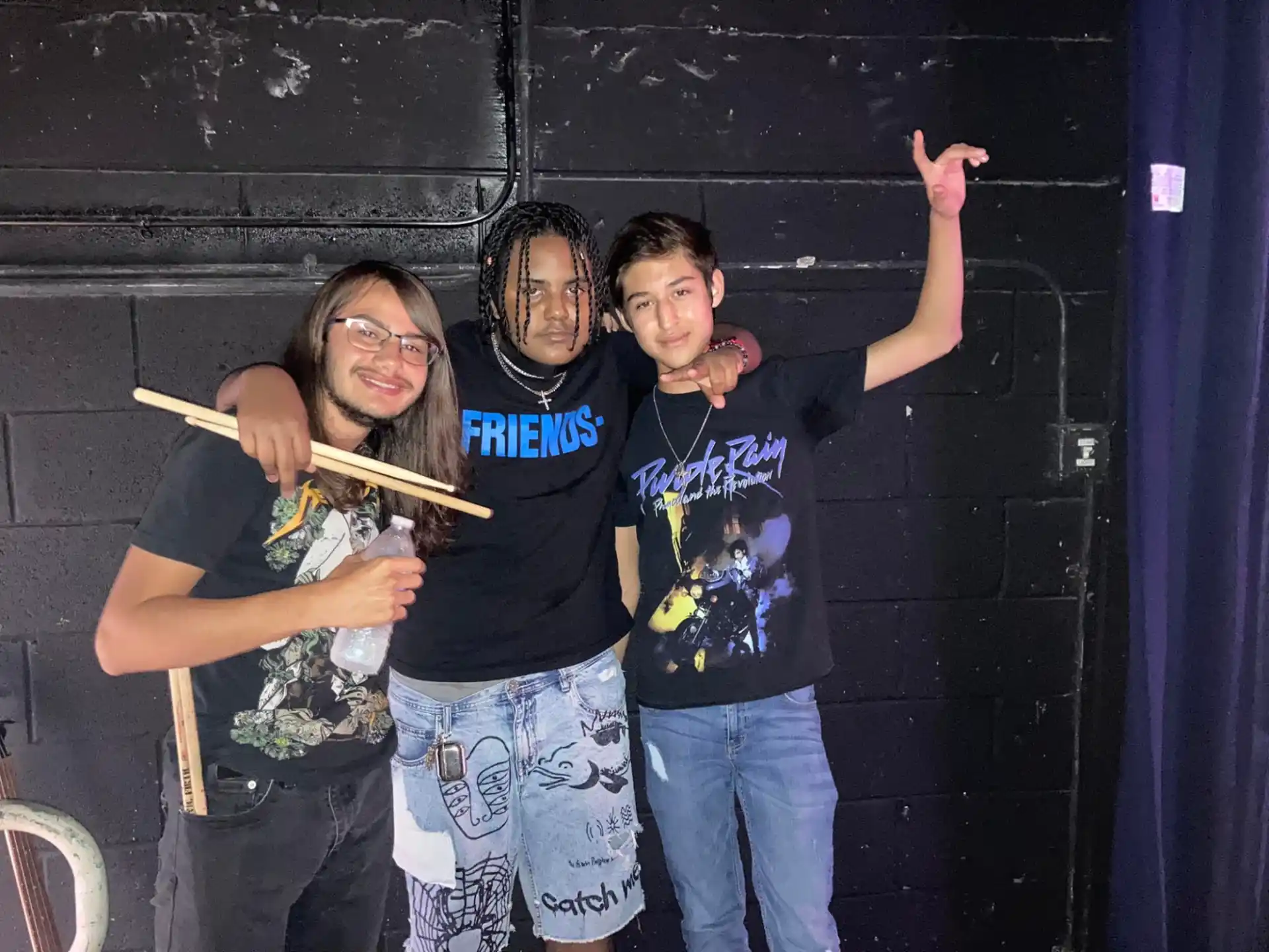a group of boys holding sticks