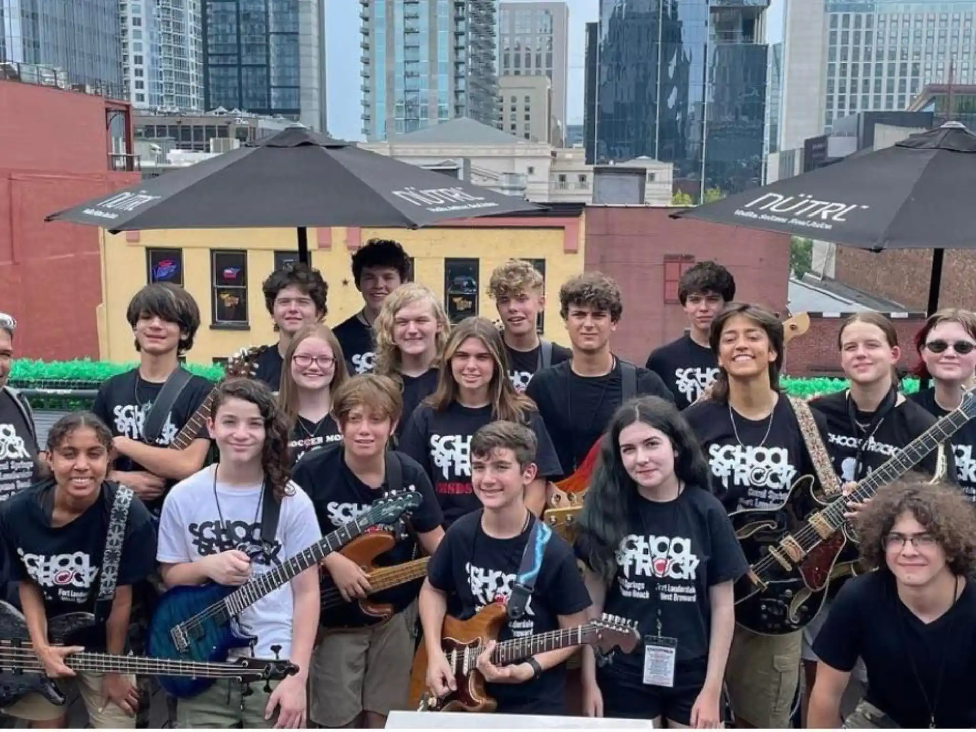 a group of people holding musical instruments