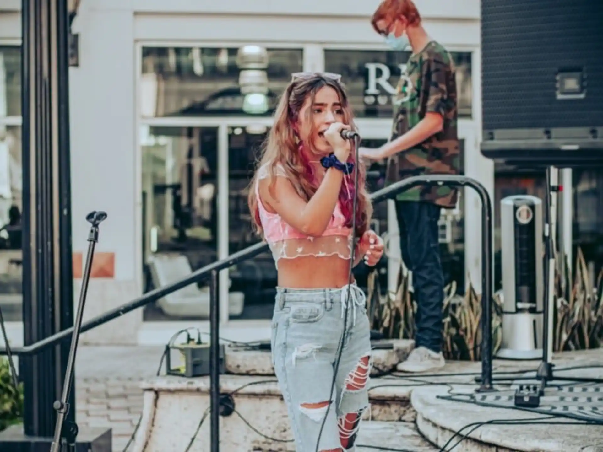a woman singing into a microphone