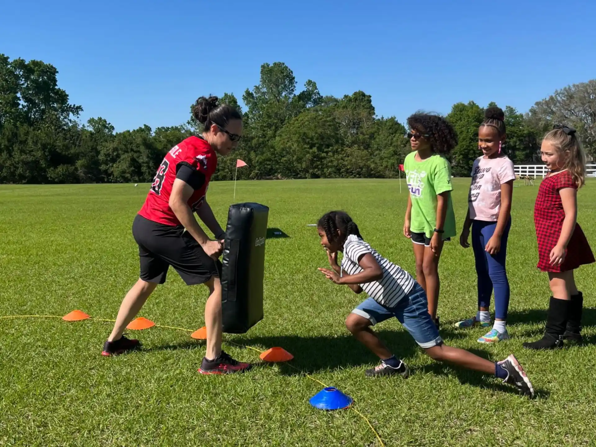 a group of people playing frisbee