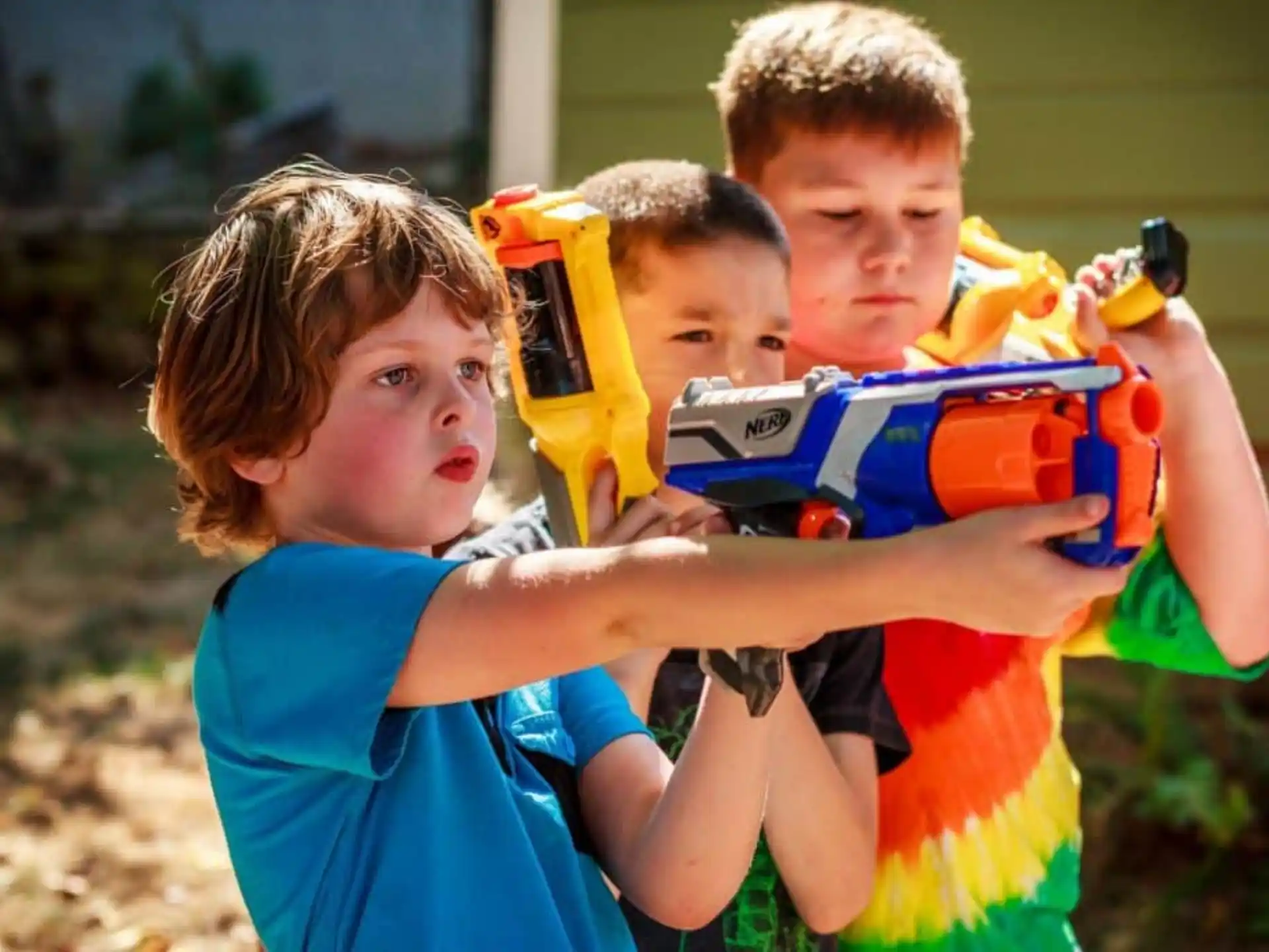 a group of kids playing with a toy
