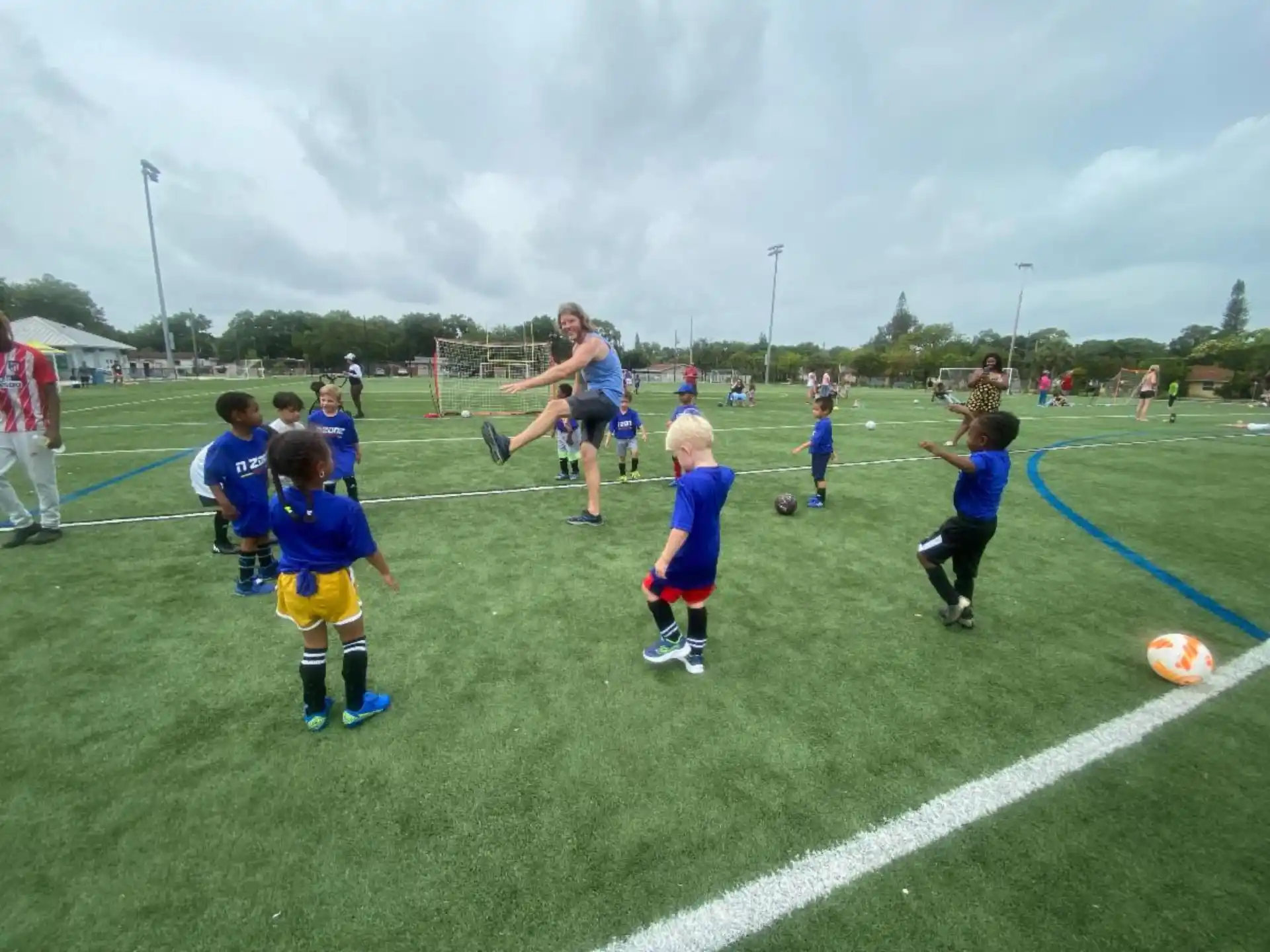a group of kids playing football