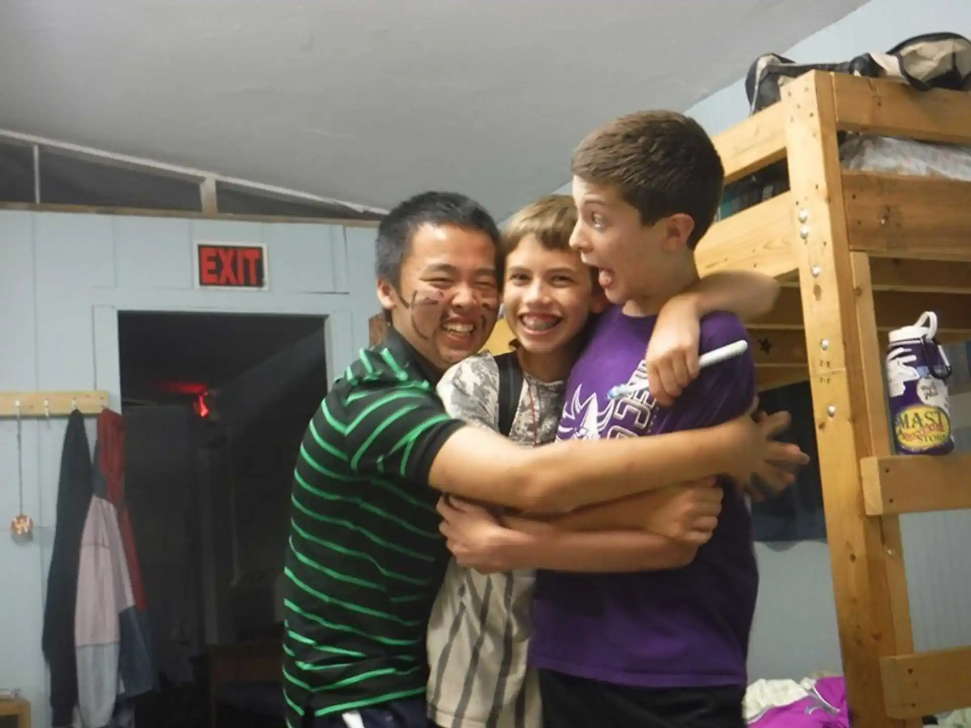 a person holding a couple of boys