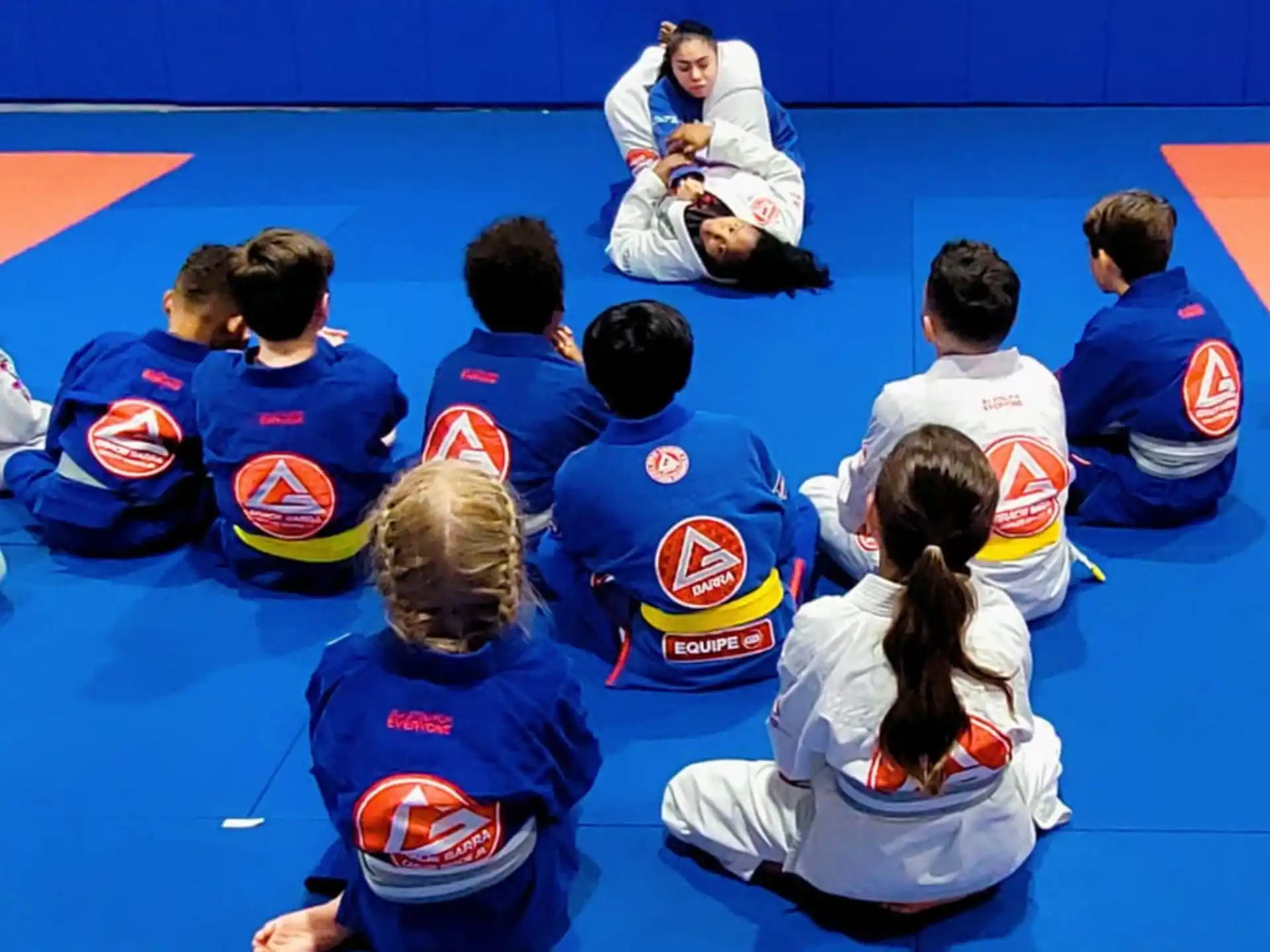 a group of people sitting on the floor
